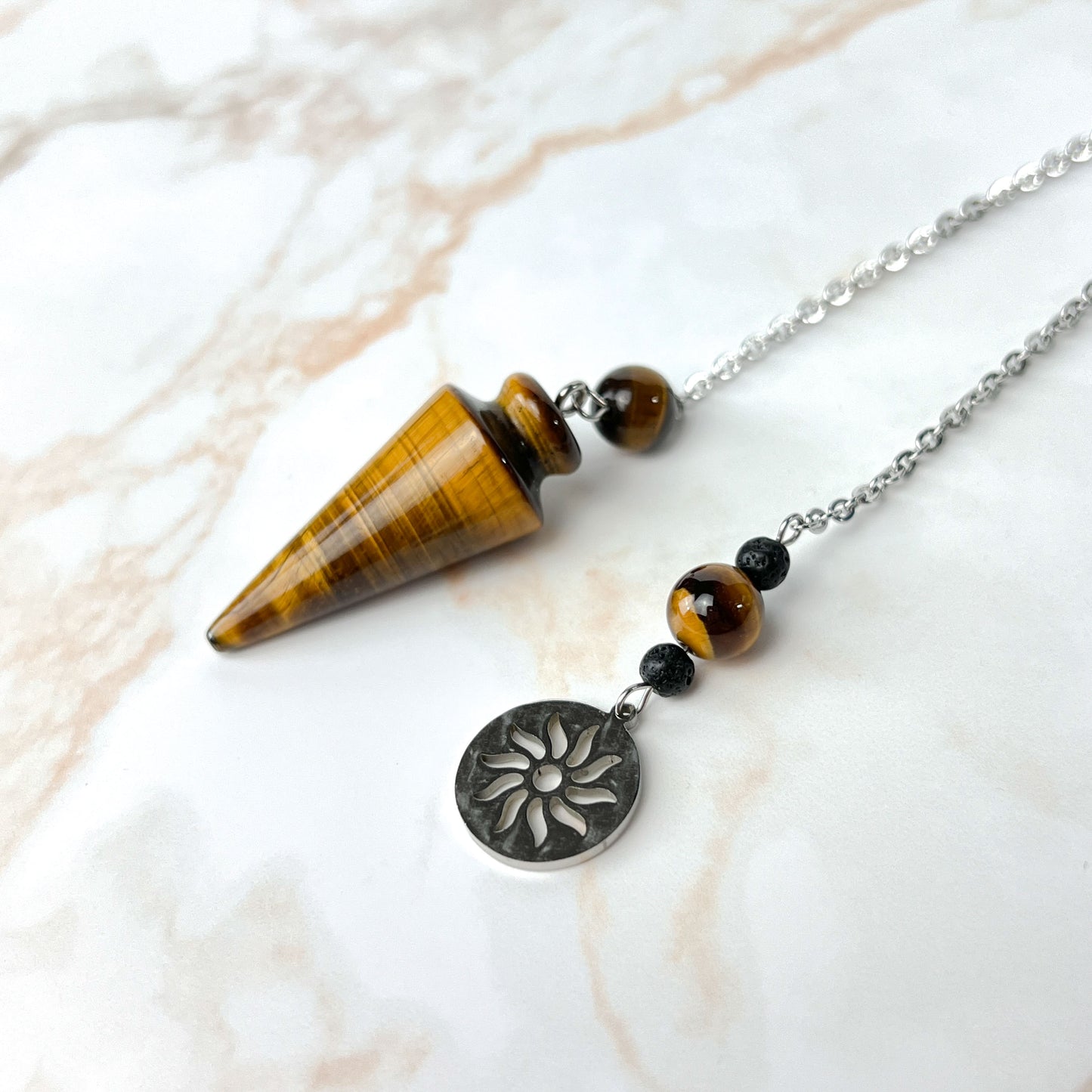 Tiger eye and stainless steel pendulum with a Sun charm Baguette Magick
