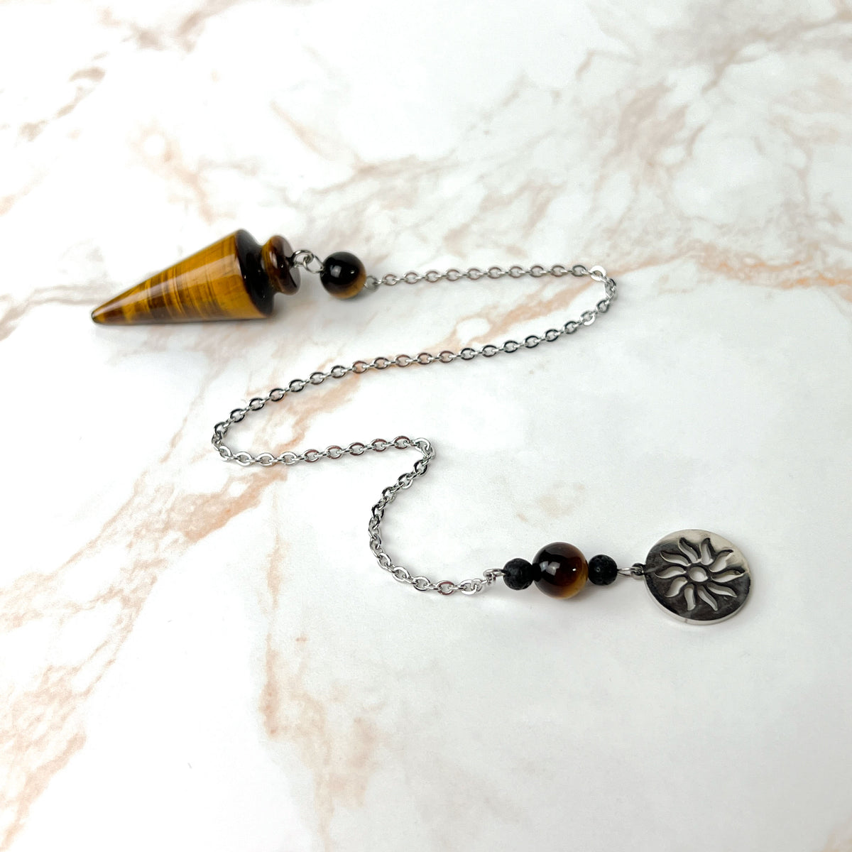Tiger eye and stainless steel pendulum with a Sun charm Baguette Magick