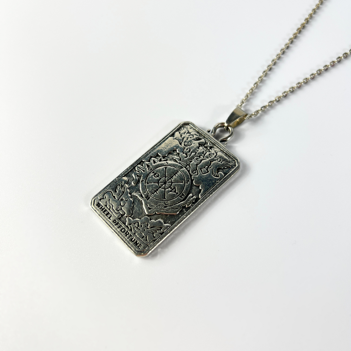 Wheel of fortune tarot arcana necklace with a reversible pendant