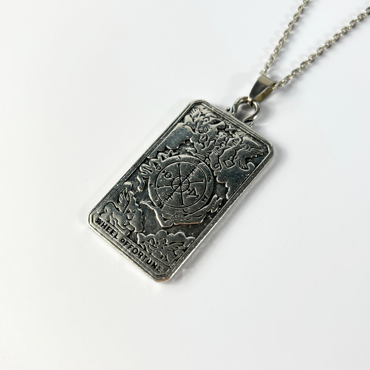 Wheel of fortune tarot arcana necklace with a reversible pendant