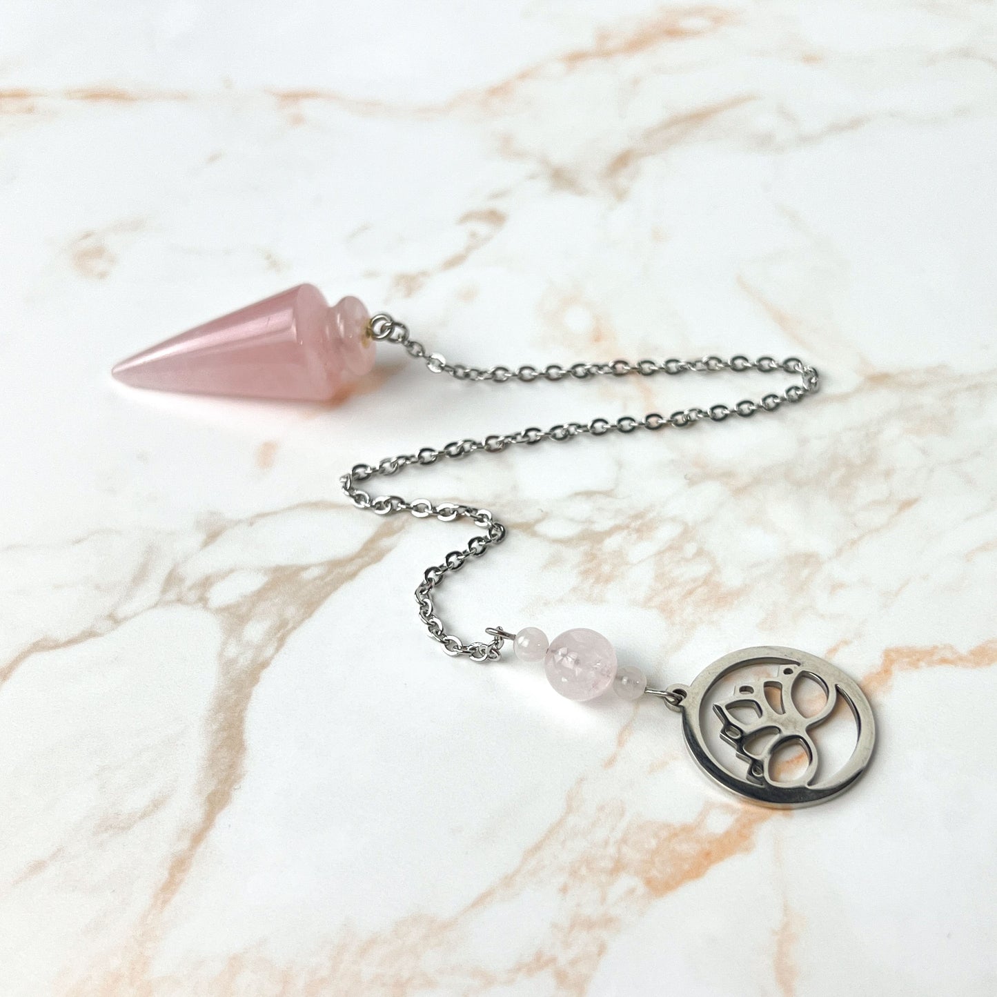Rose quartz and stainless steel lotus flower pendulum Baguette Magick