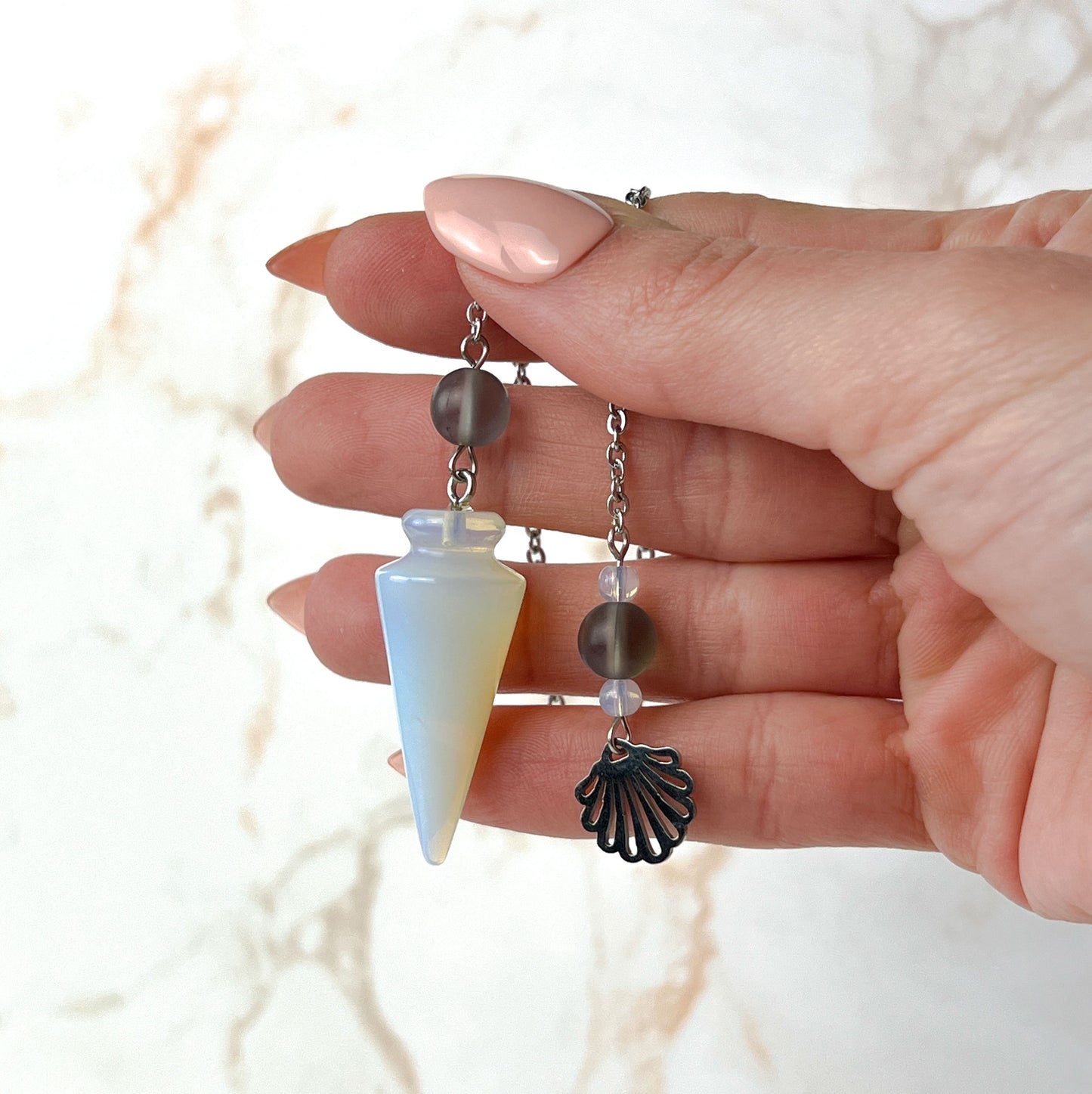 Sea witch pendulum made with opalite, stainless steel and mermaid glass Baguette Magick