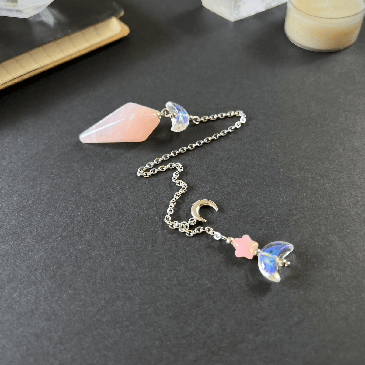 Celestial rose quartz dowsing pendulum, with moon & star charms