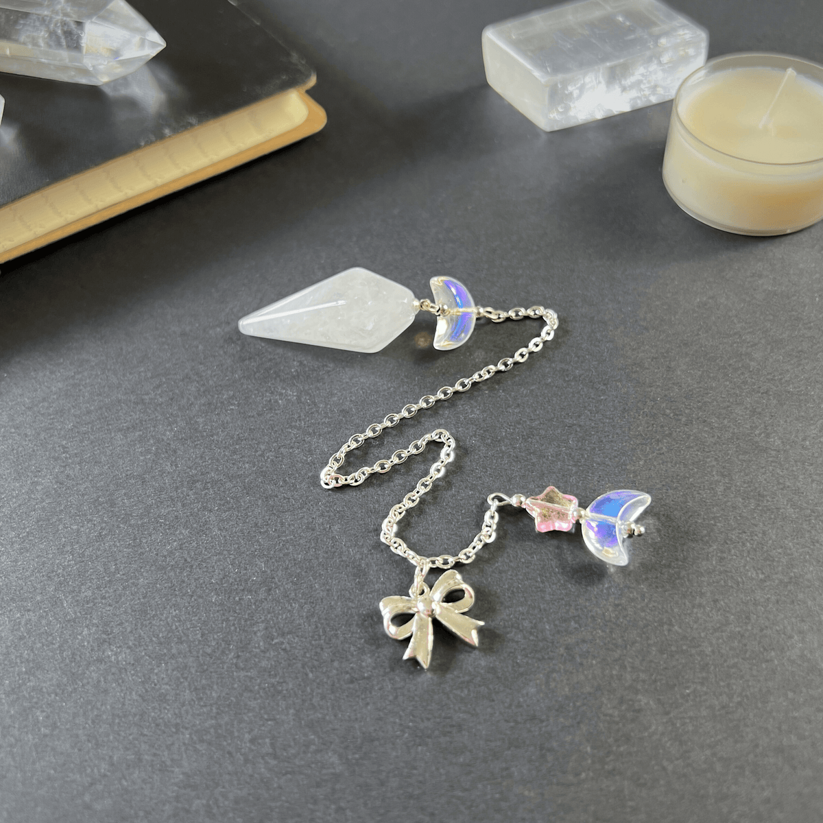 Celestial Clear Quartz dowsing pendulum, with moon, star & bow charms