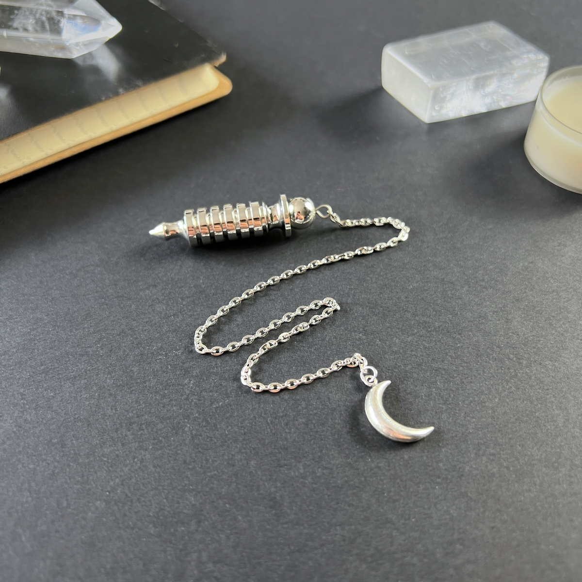 Egyptian Isis metal dowsing pendulum with a chamber and a Moon crescent