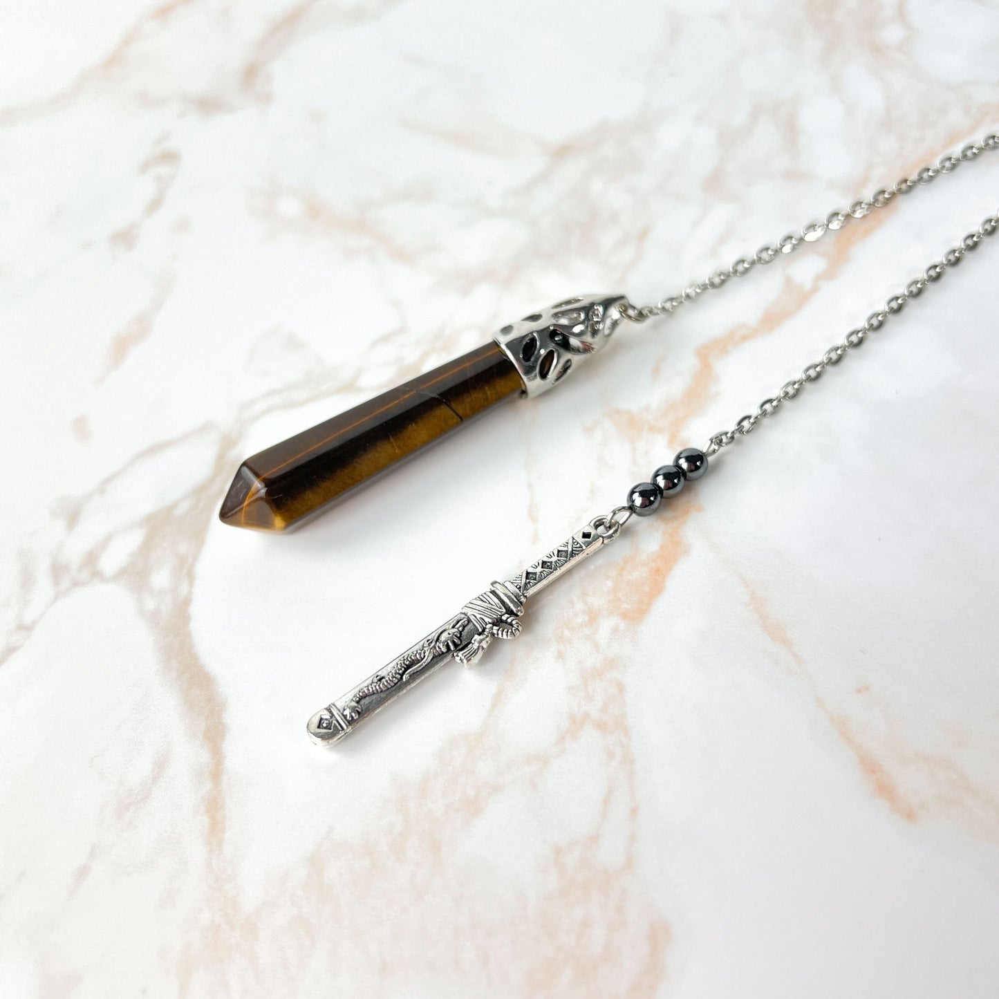 Tiger eye, hematite and tanto dagger pendulum Baguette Magick
