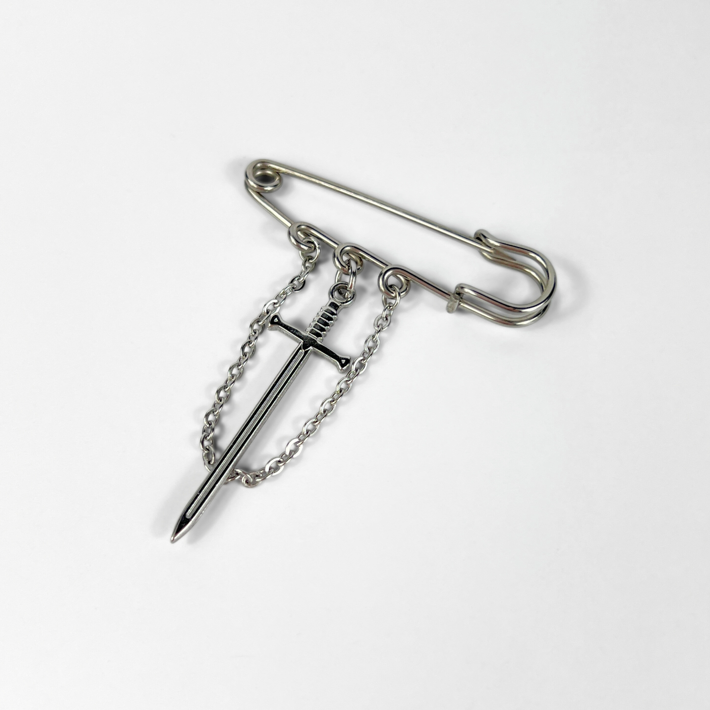 Kilt pin brooch adorned with gemstones, crystal, charms