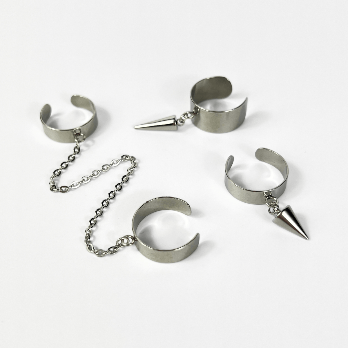 Sleek spikes or chain rings, polished stainless steel avant-garde jewelry Baguette Magick