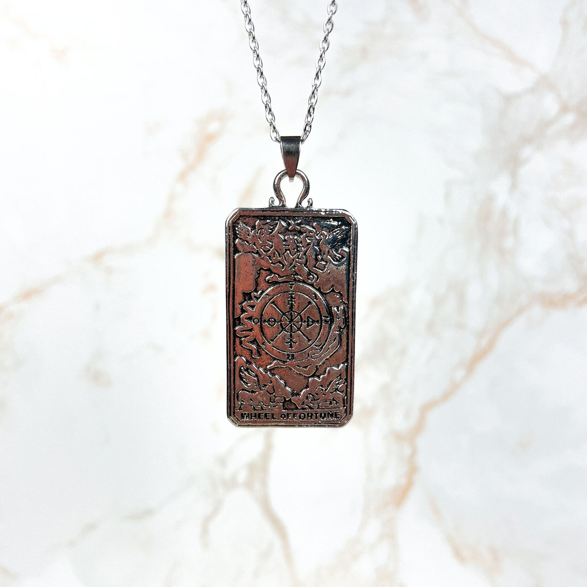 Wheel of fortune tarot arcana necklace with a reversible pendant Baguette Magick