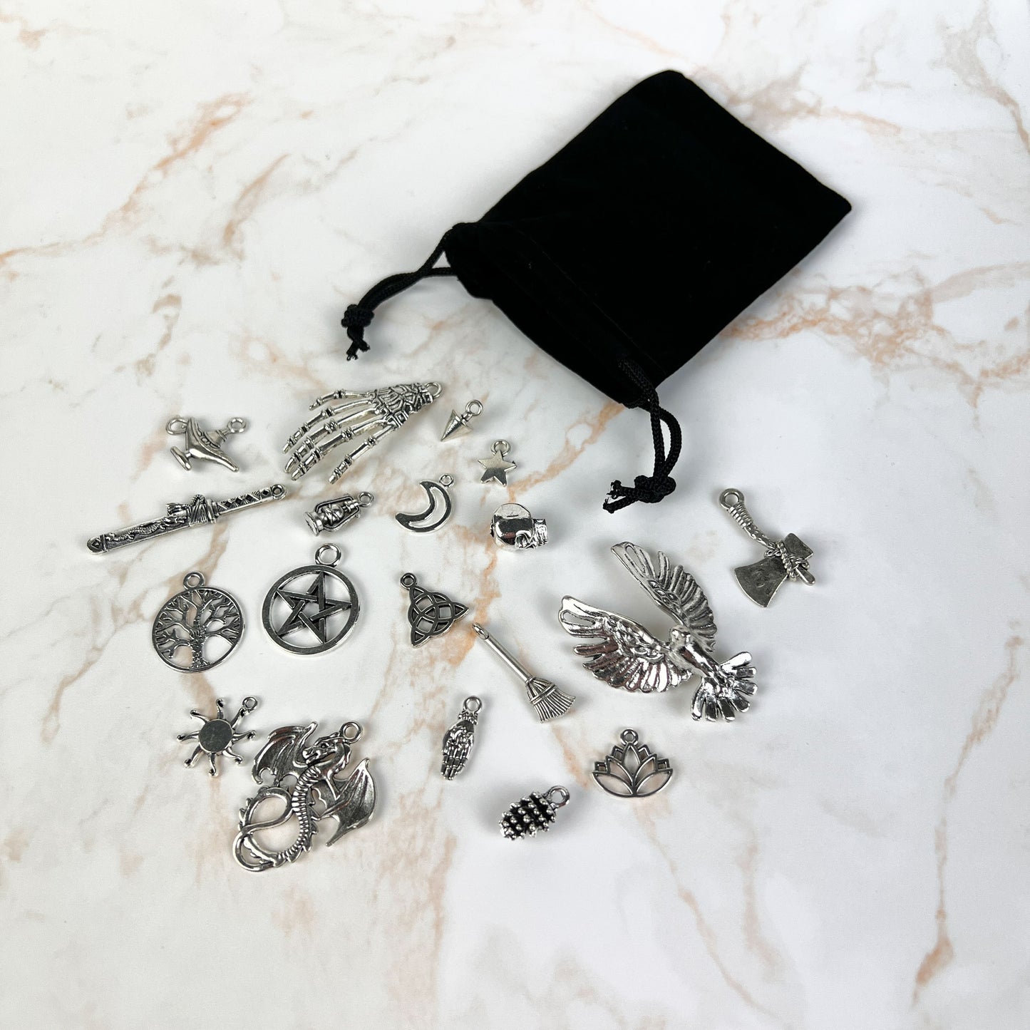 Charm casting set with its black velvet pouch, lantern version