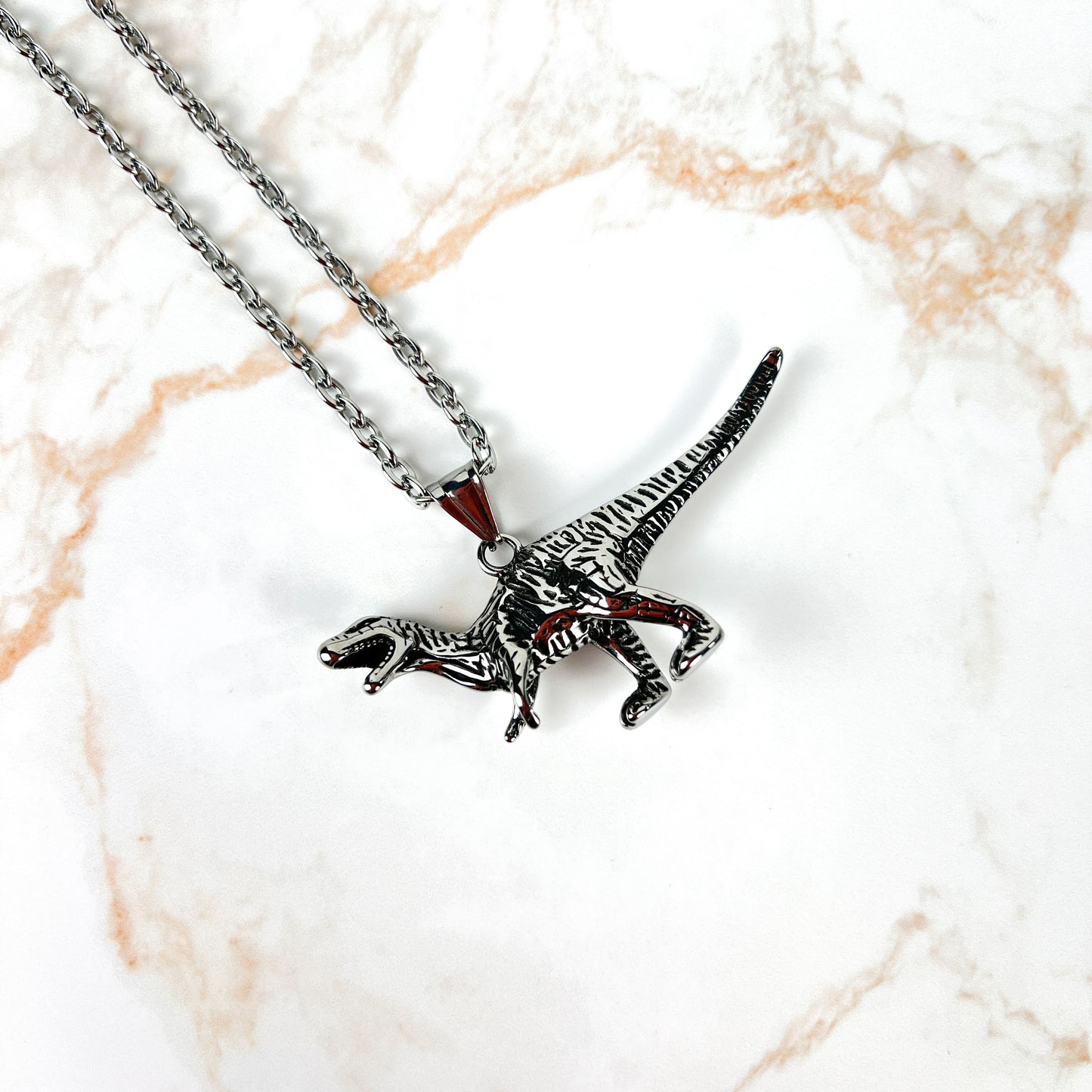 Raptor dinosaur necklace, stainless steel