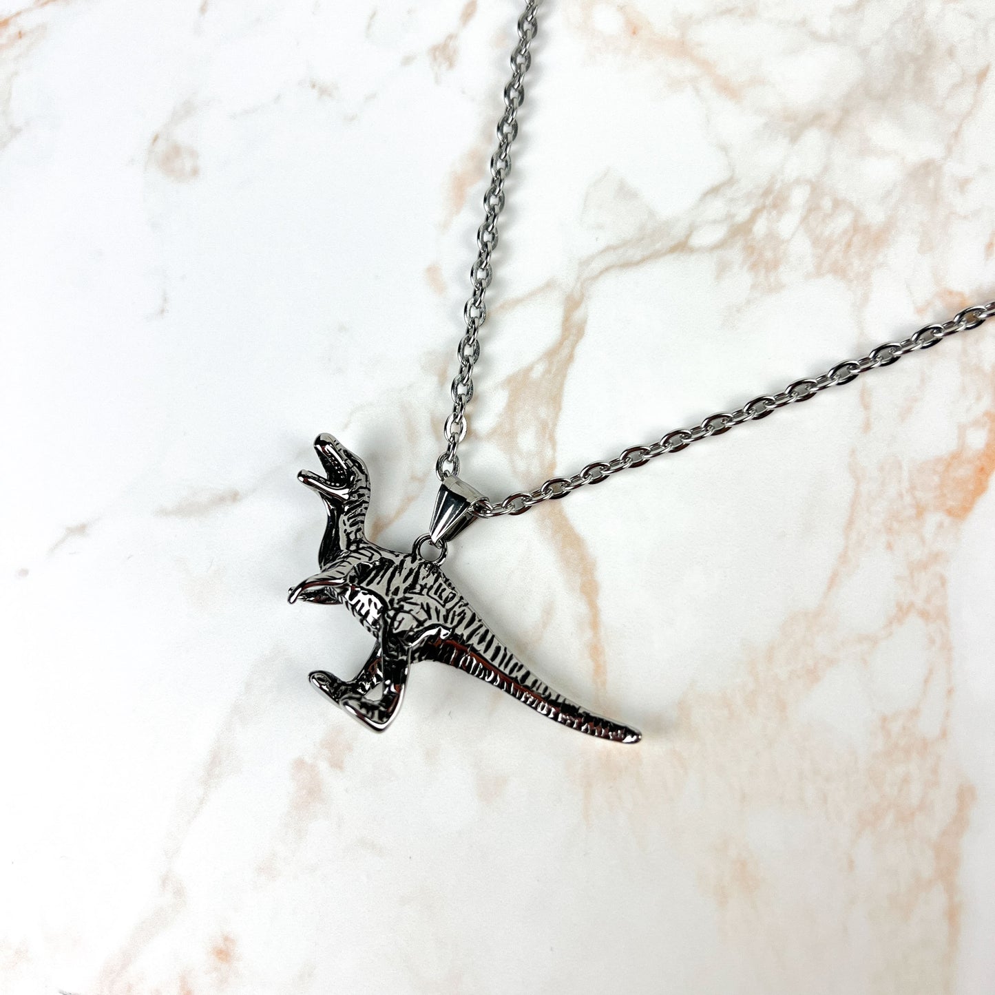 Raptor dinosaur necklace, stainless steel