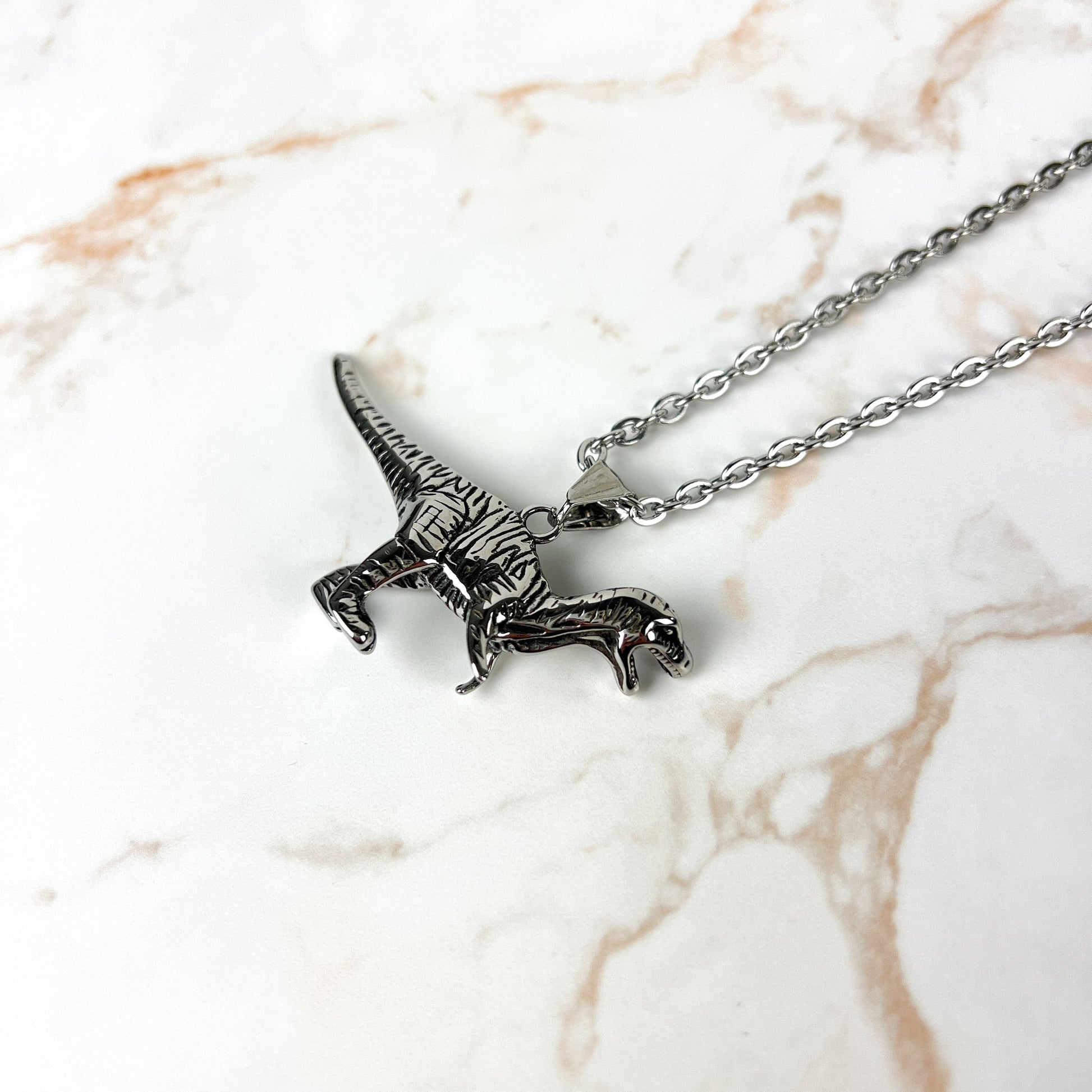 Raptor dinosaur necklace, stainless steel Baguette Magick