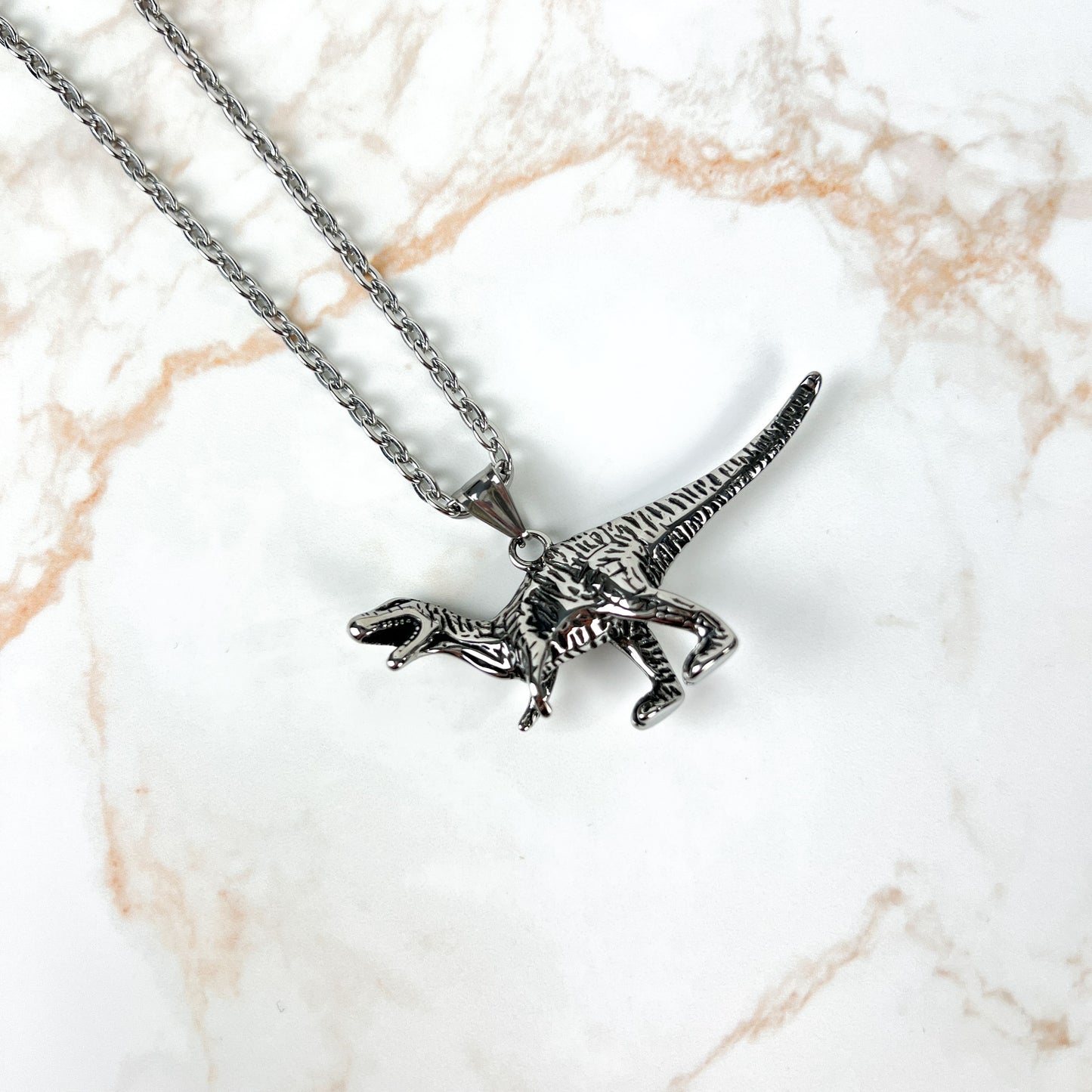 Raptor dinosaur necklace, stainless steel