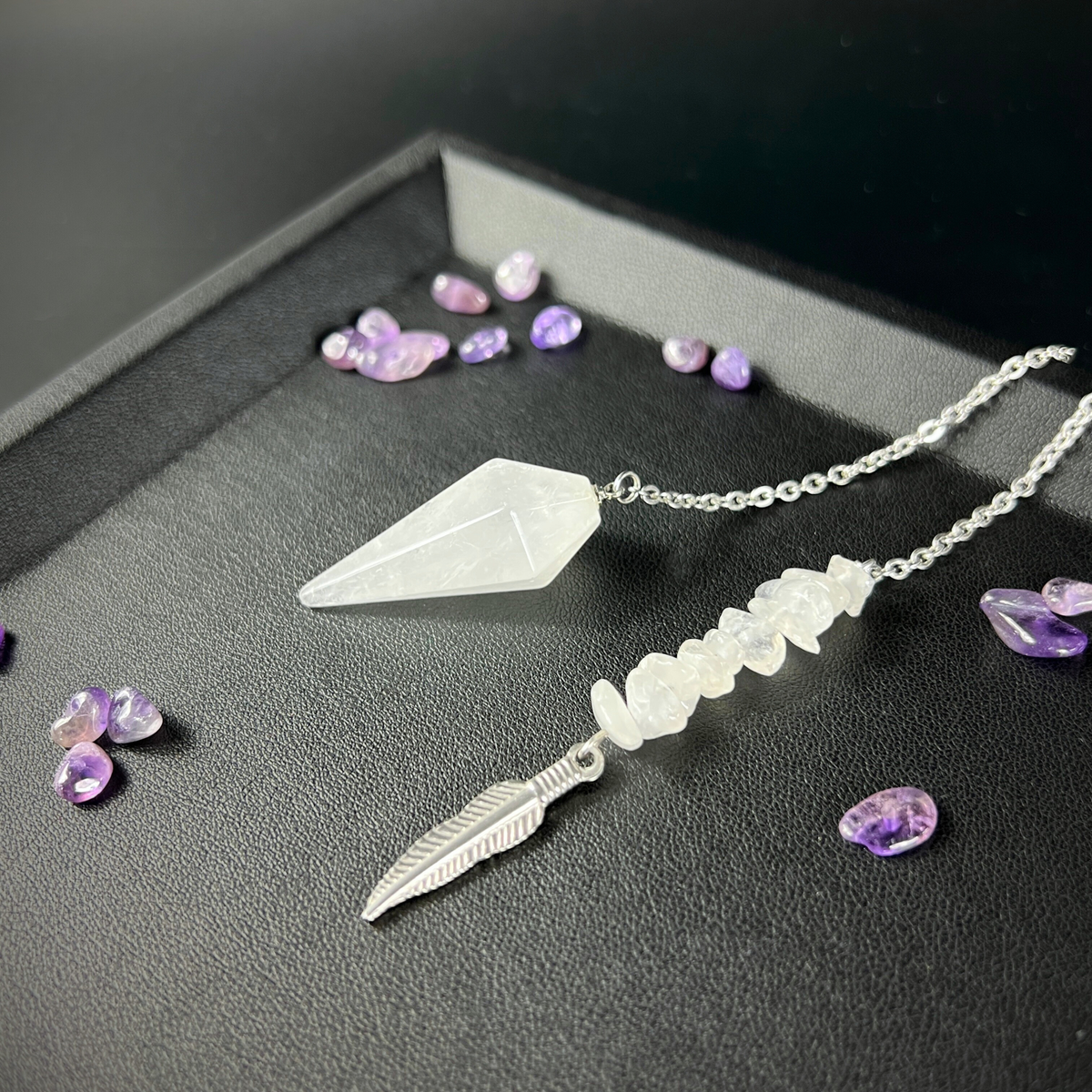 Clear quartz and feather pendulum