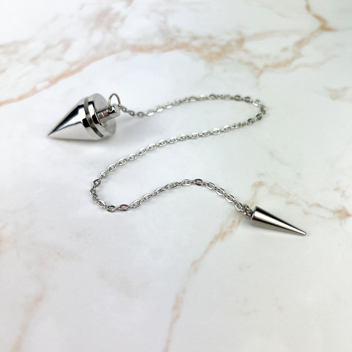 Cone and coil classic dowsing metal pendulum with a spike charm Baguette Magick