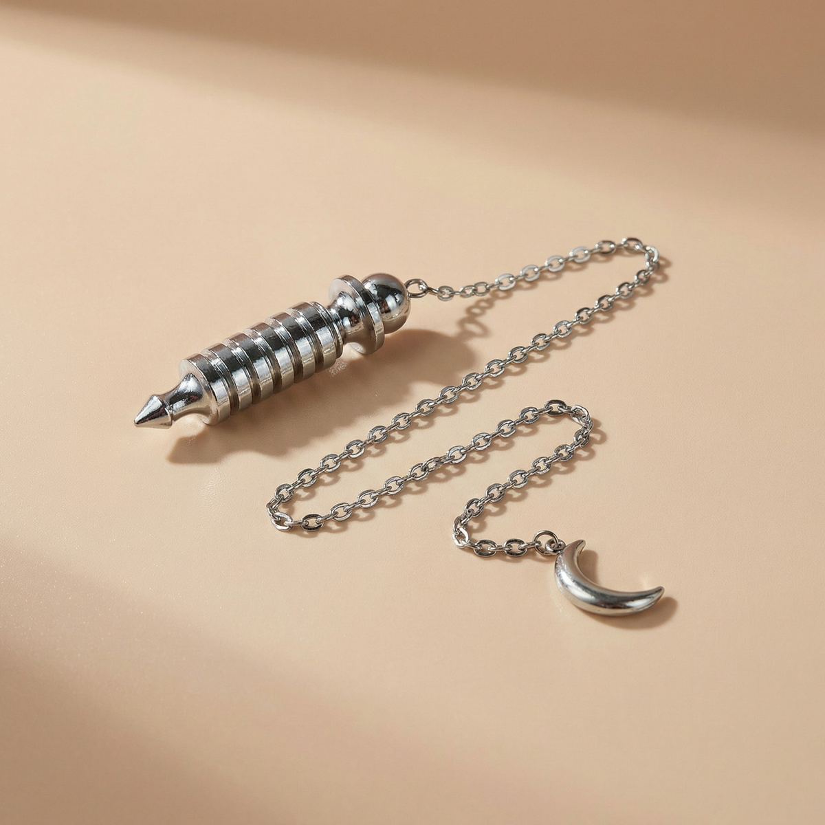 Egyptian Isis metal dowsing pendulum with a chamber and a Moon crescent