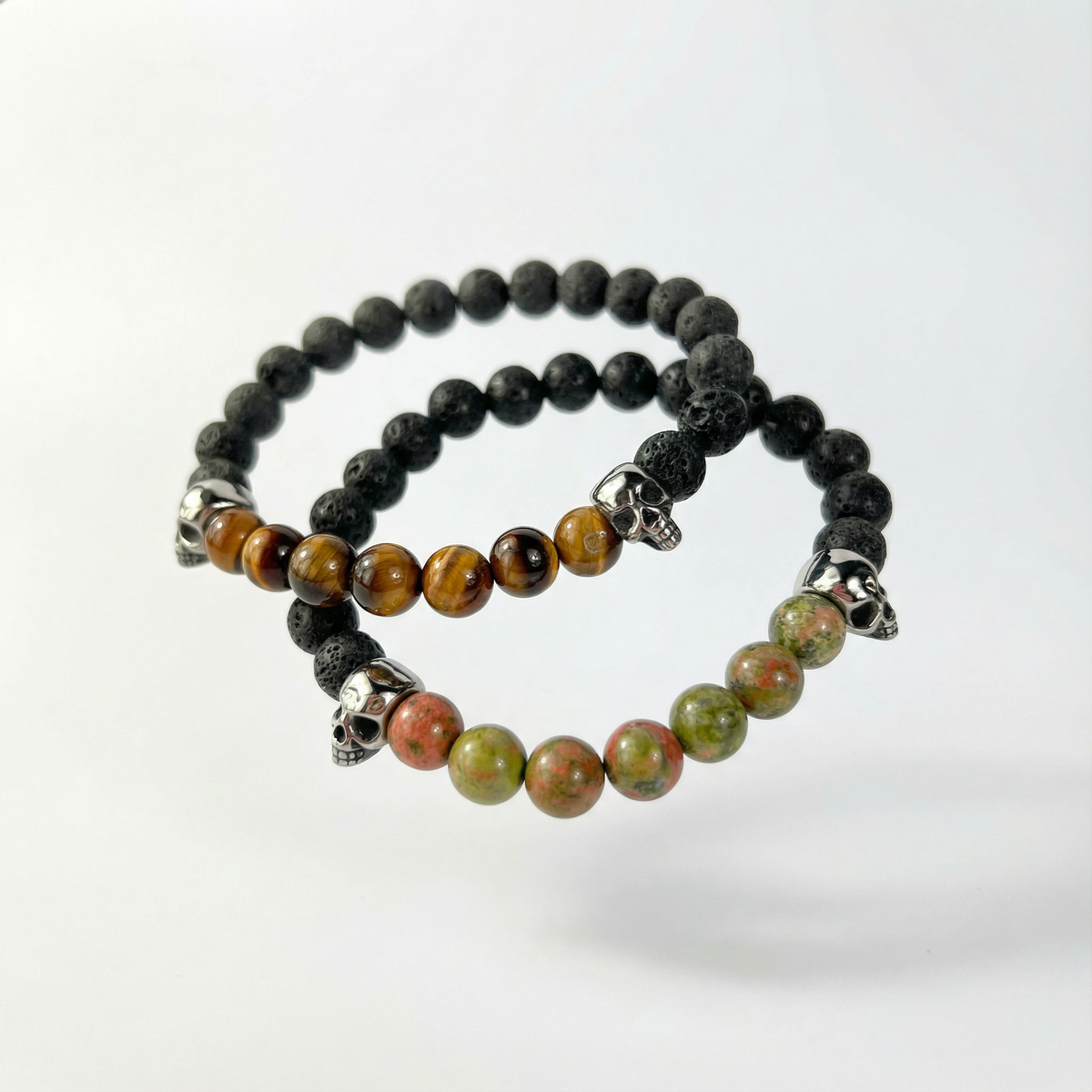 Lava rock and unakite or tiger's eye mala bracelet, with skulls Baguette Magick