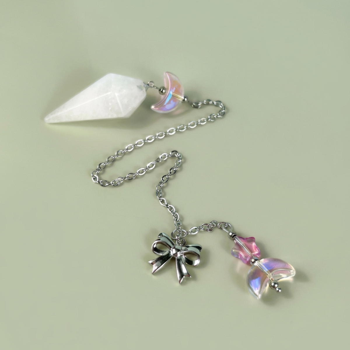 Celestial Clear Quartz dowsing pendulum, with moon, star & bow charms