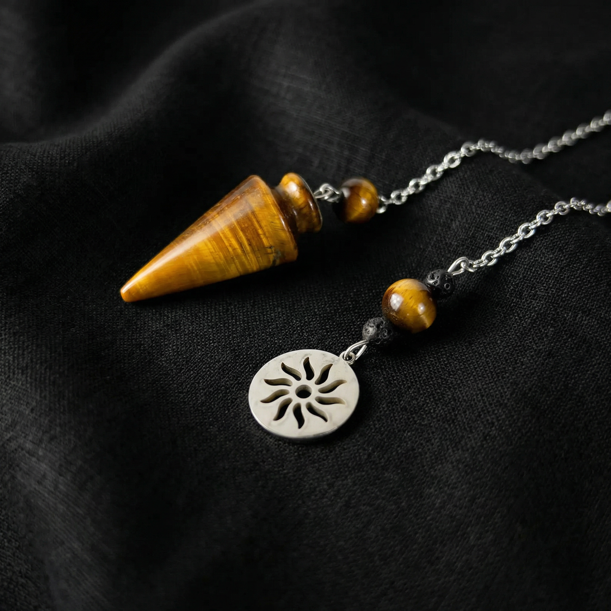 Tiger eye pendulum with a Sun charm