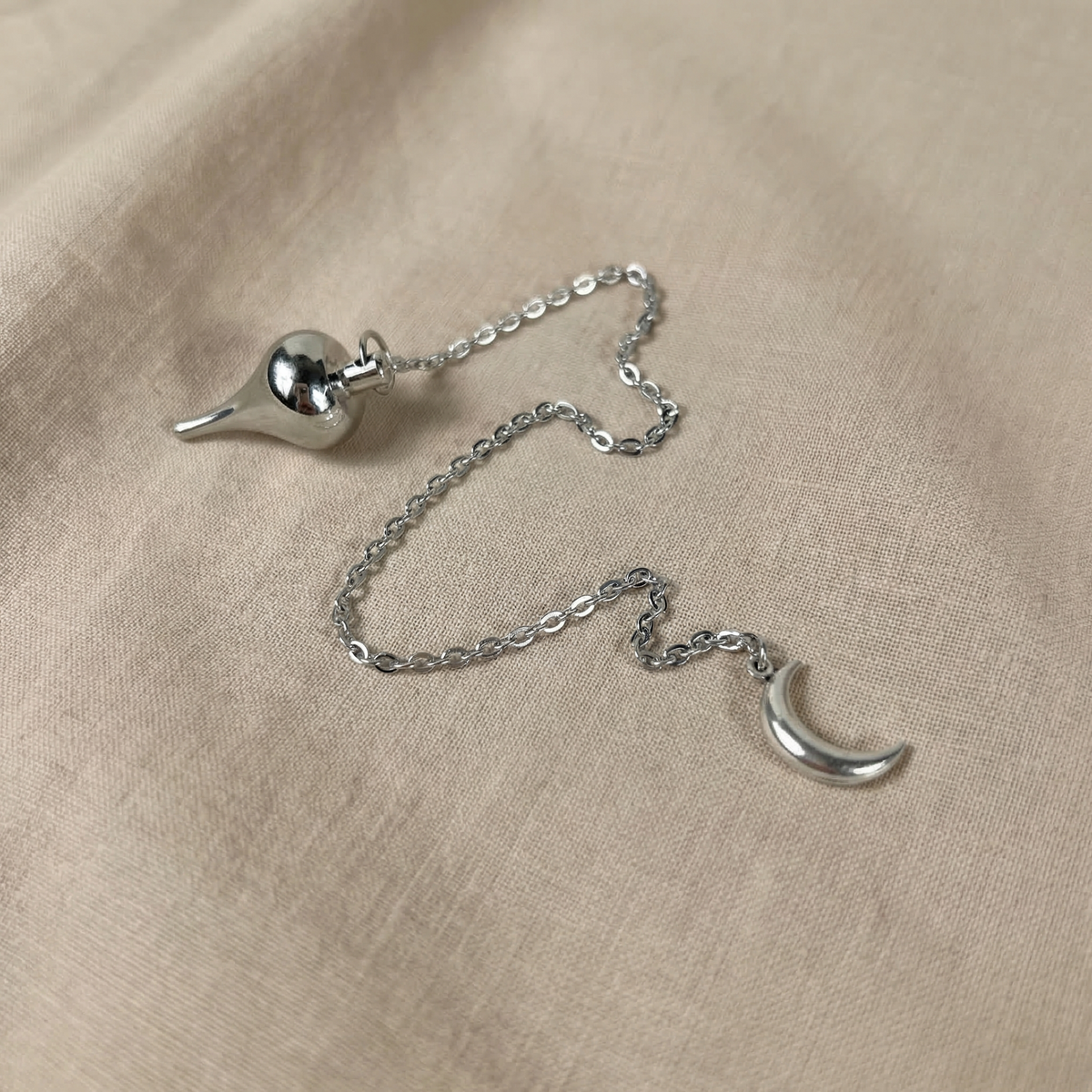 Luzi dowsing metal pendulum with a crescent Moon