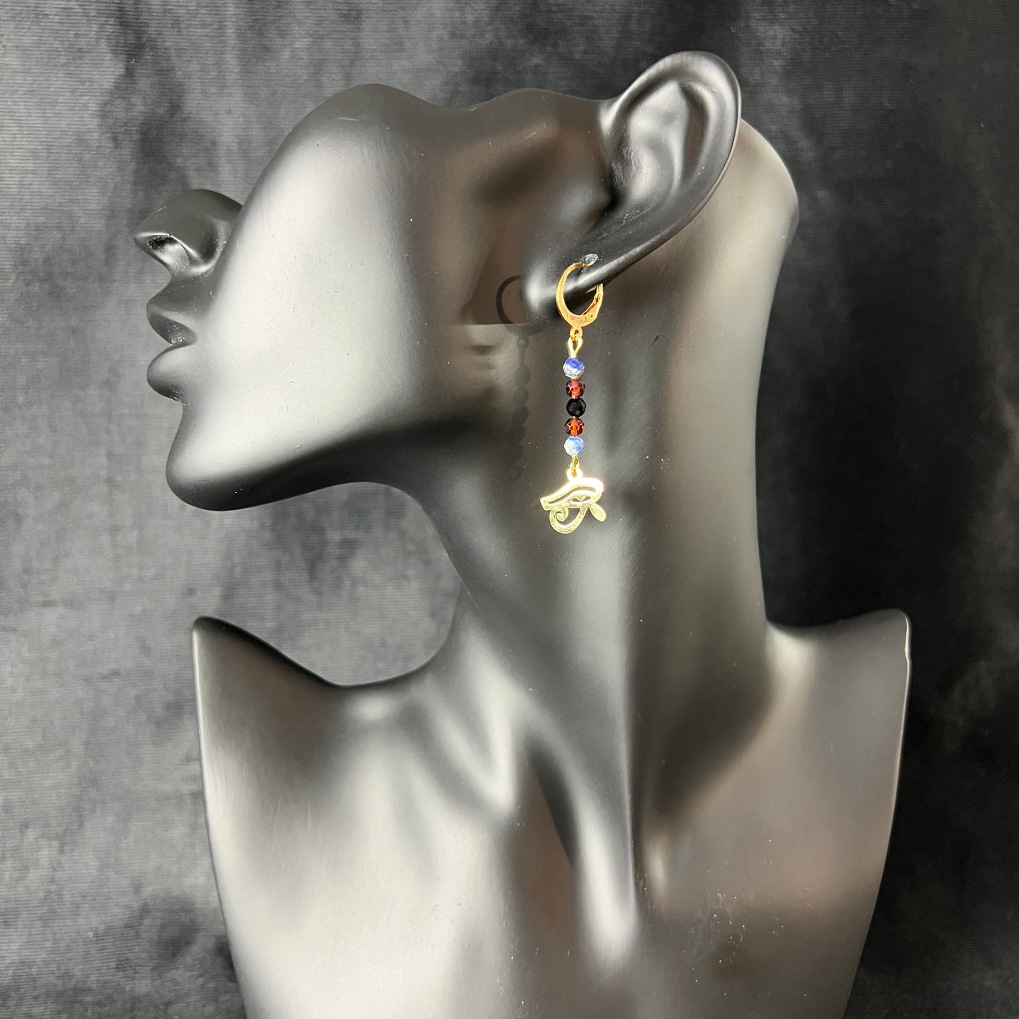 Eye of Horus earrings, golden stainless steel, lapis lazuli, garnet and onyx Baguette Magick