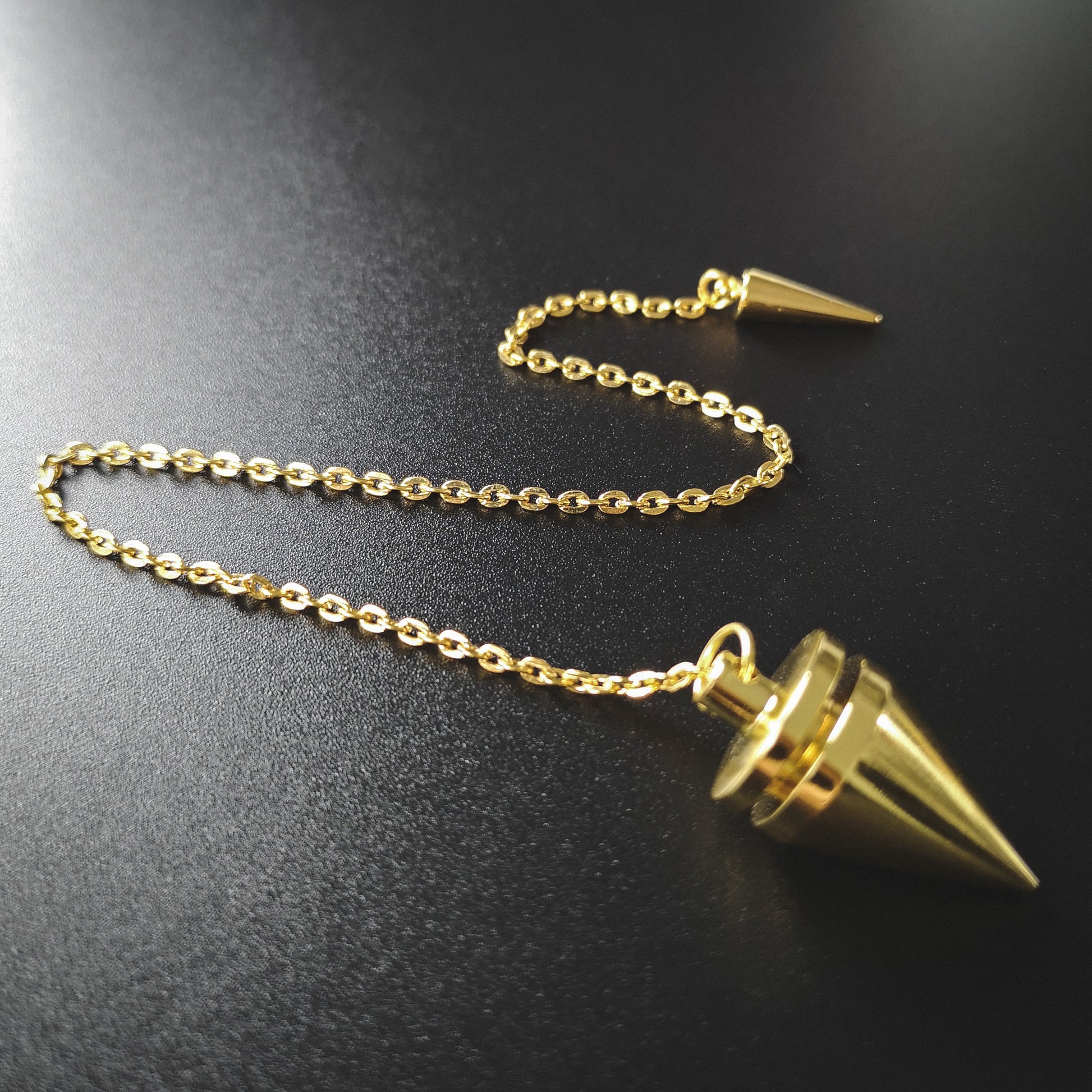 Golden cone and coil classic dowsing metal pendulum with a spike charm Baguette Magick