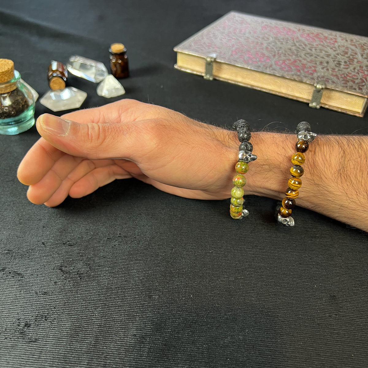 Lava rock and unakite or tiger's eye mala bracelet, with stainless steel skulls Baguette Magick