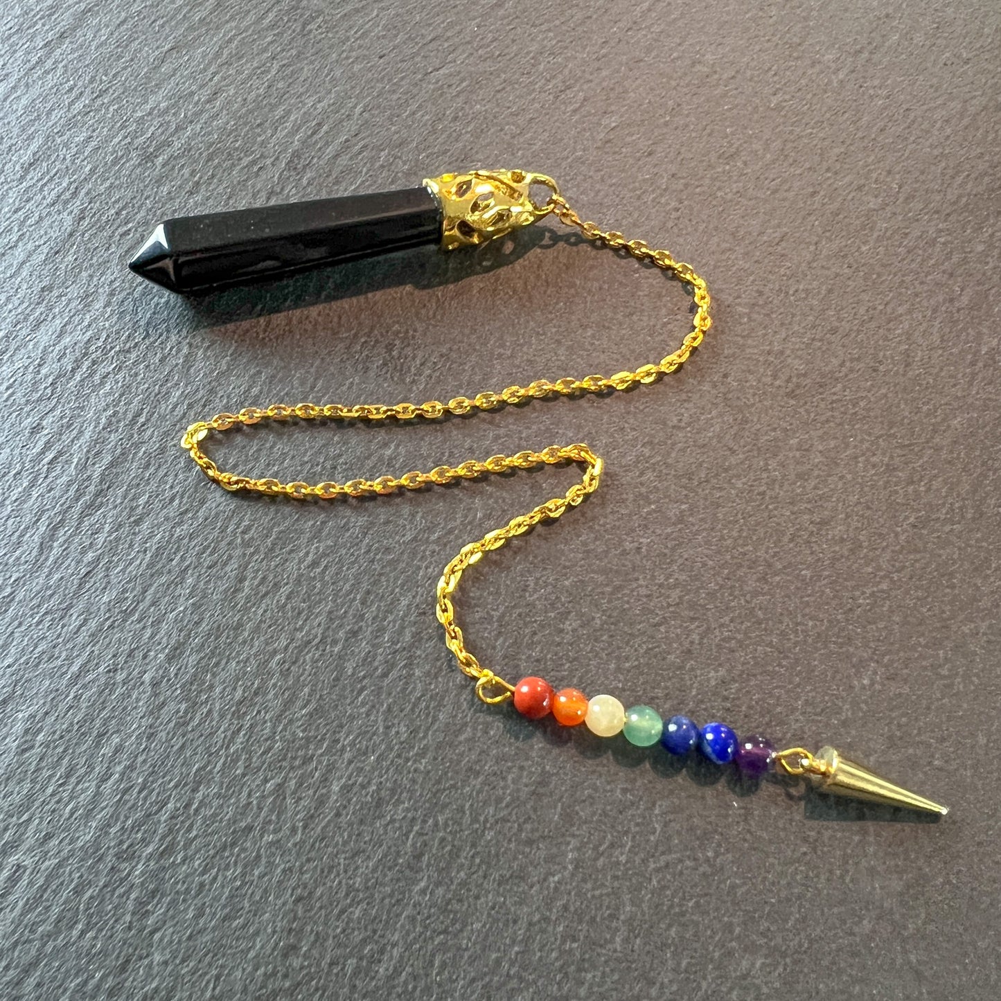 Golden onyx and seven chakras stones pendulum with a spike Baguette Magick