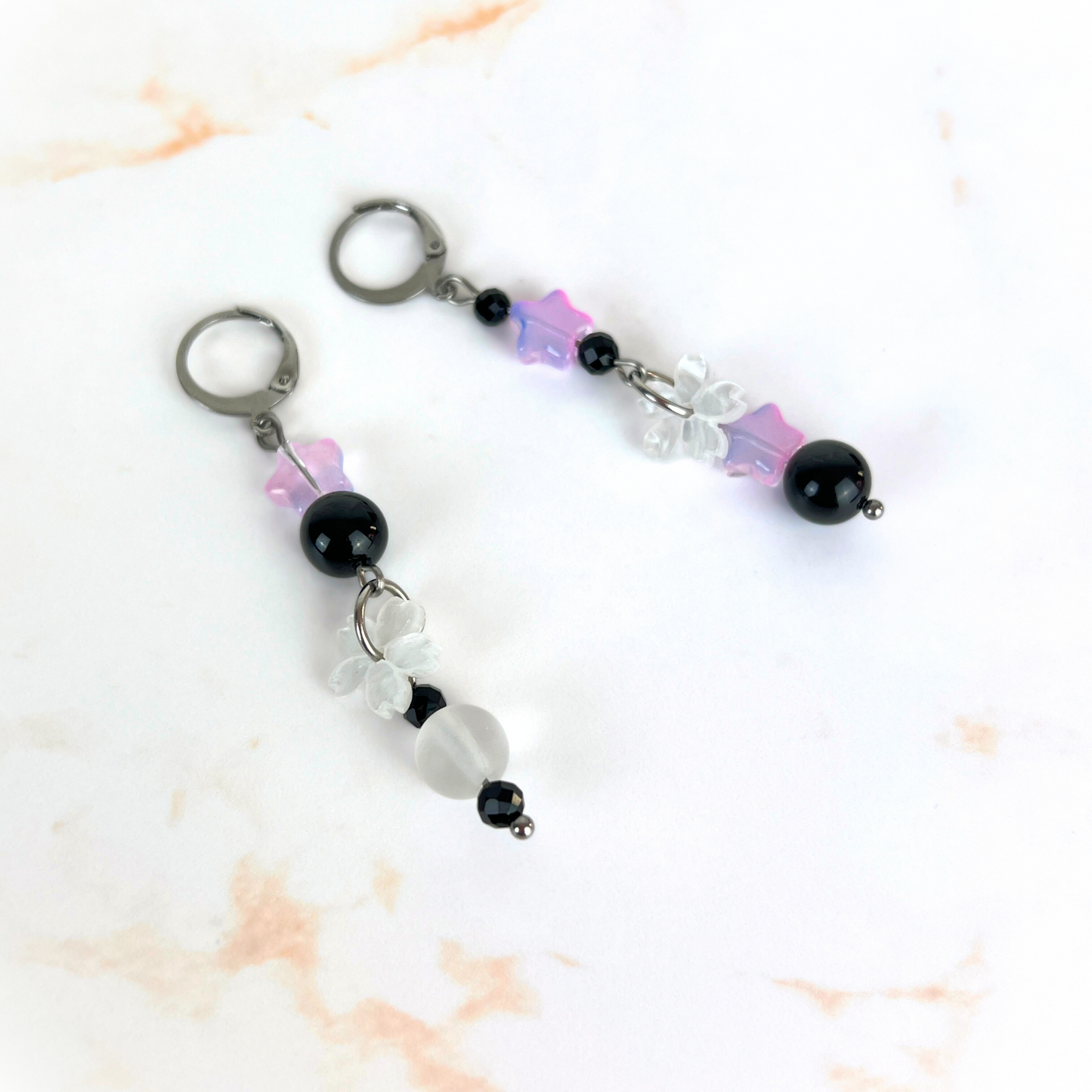 The Celestial Nocture earrings: Rainbow Obsisidan, Onyx, Holo glass, stars and Sakura, stainless steel Baguette Magick