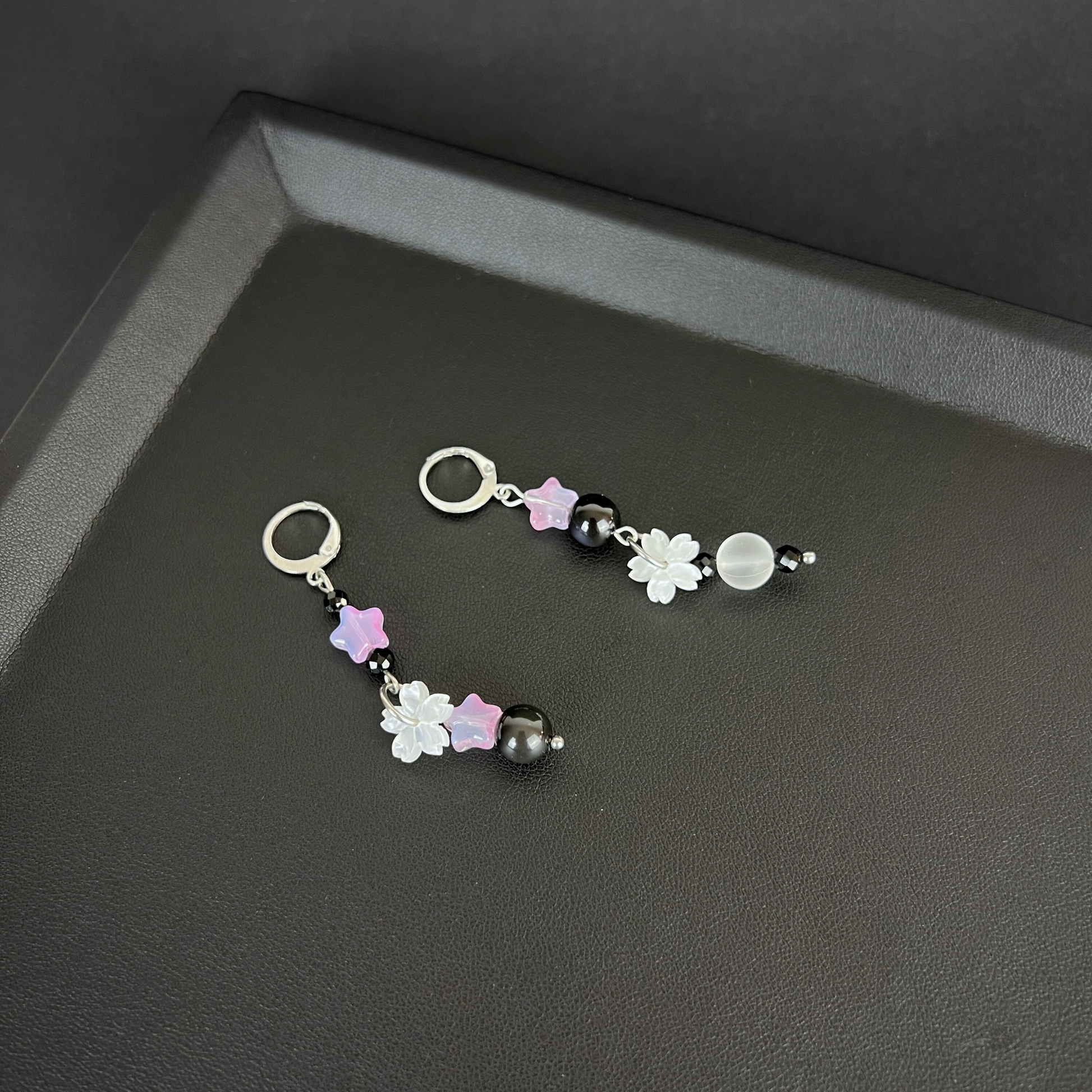 The Celestial Nocture earrings: Rainbow Obsisidan, Onyx, Holo glass, stars and Sakura, stainless steel Baguette Magick