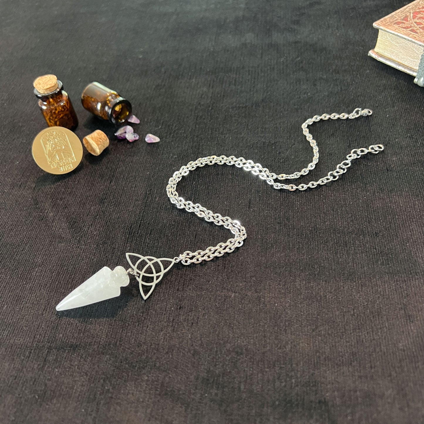 Clear quartz and triquetra Celtic knot pendulum necklace, stainless steel Baguette Magick