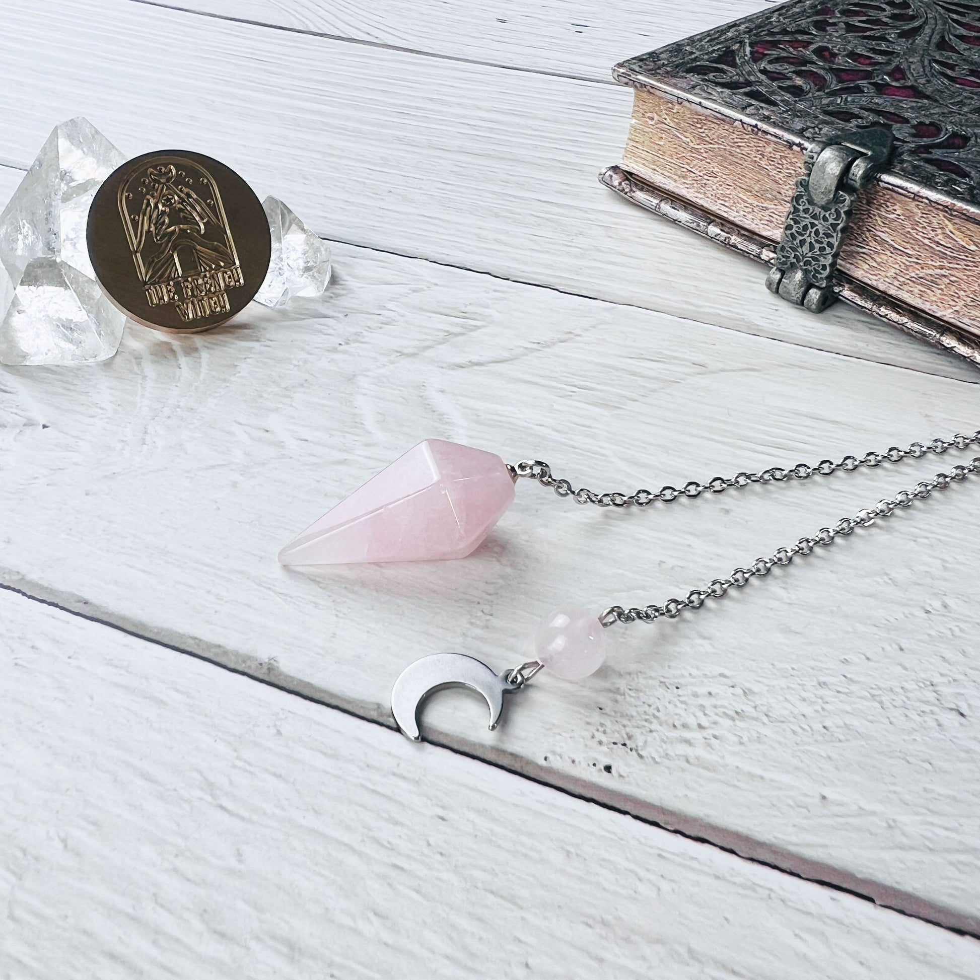 Rose quartz gemstone dowsing pendulum crescent moon and stainless steel witch divination tool