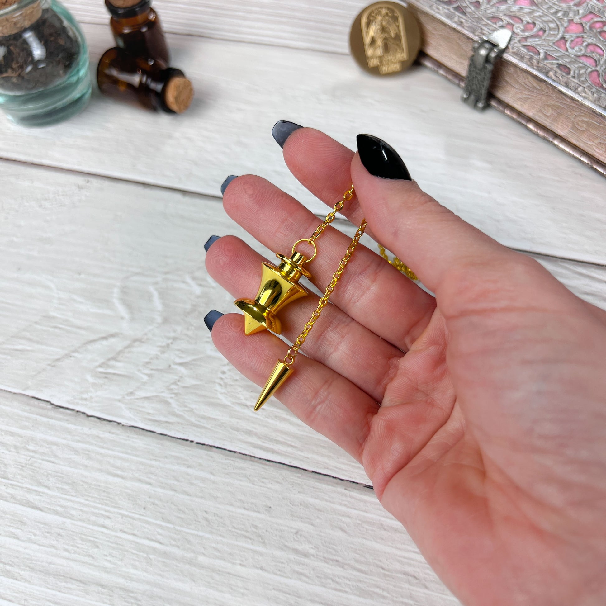 Golden point and dome dowsing metal pendulum with a spike charm Baguette Magick