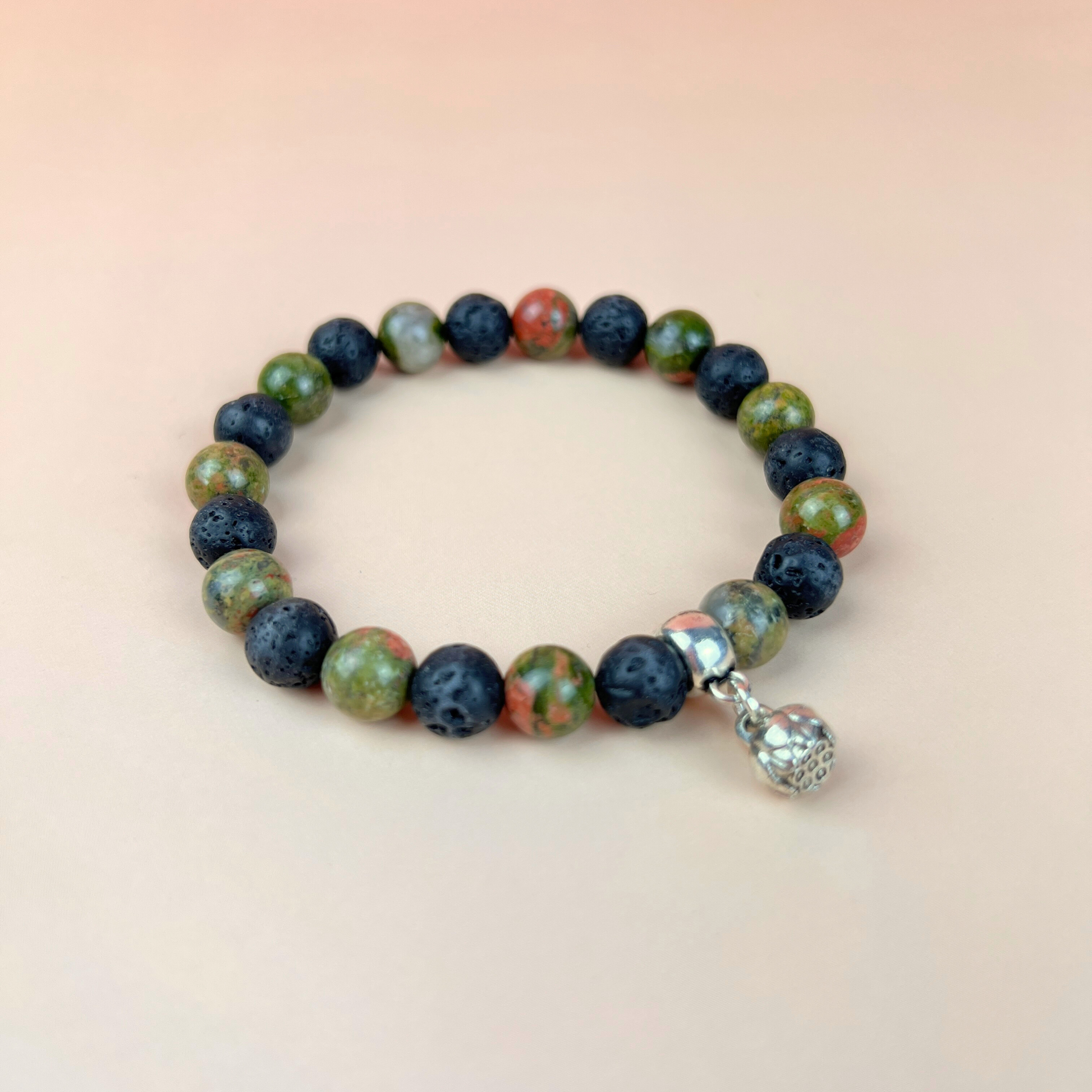 Unakite and lava mala beaded bracelet with a lotus seed charm Baguette Magick