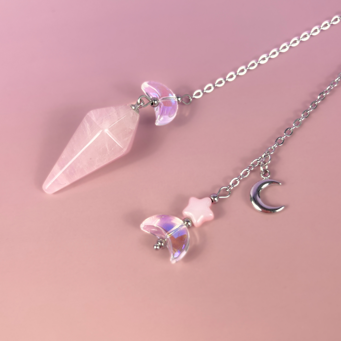 Celestial rose quartz dowsing pendulum, with moon & star charms