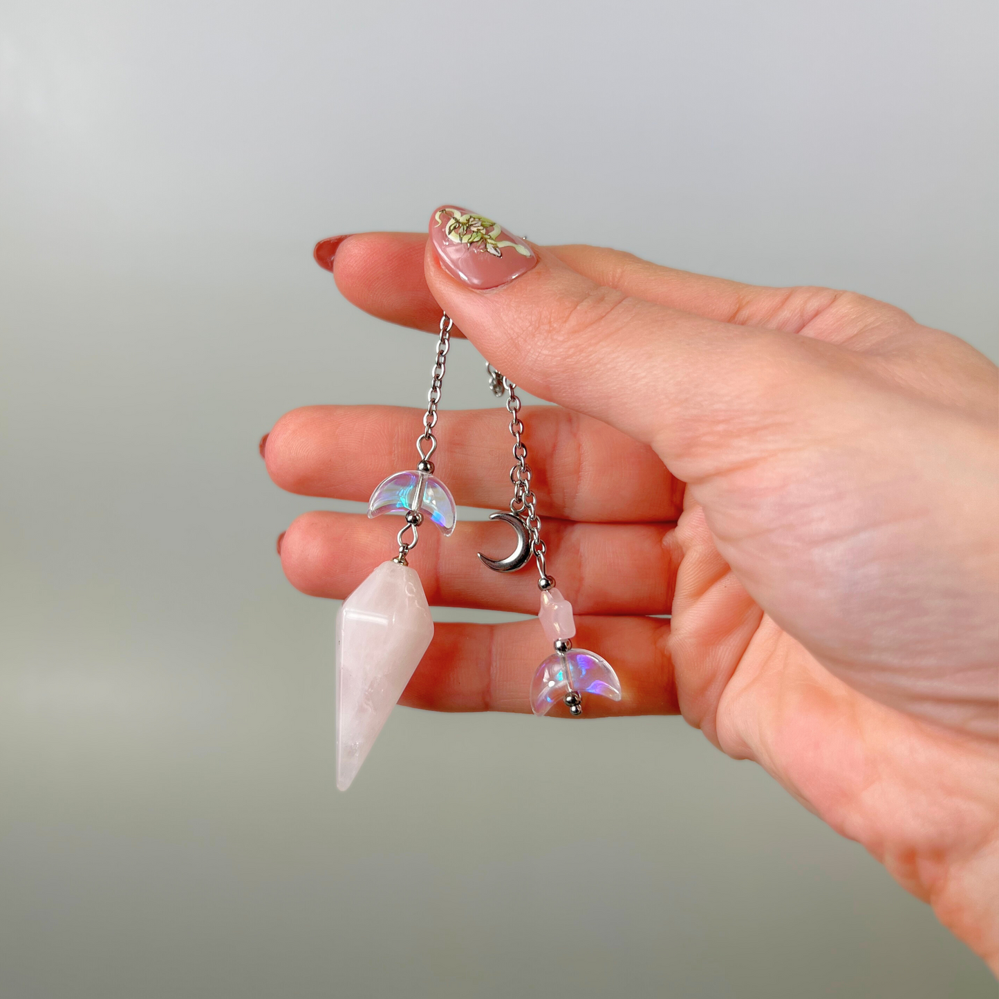 Celestial rose quartz dowsing pendulum, with moon & star charms