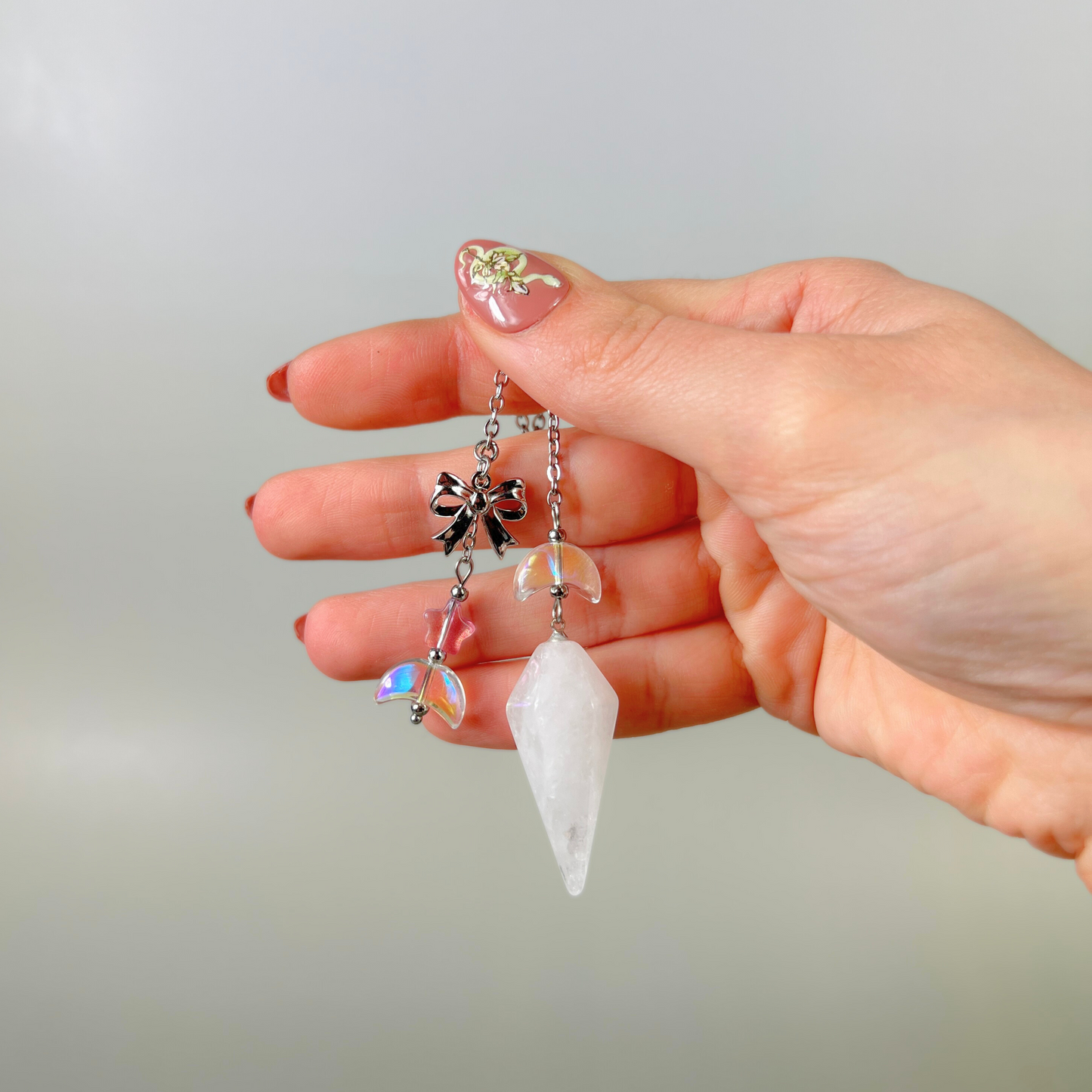 Celestial Clear Quartz dowsing pendulum, with moon, star & bow charms