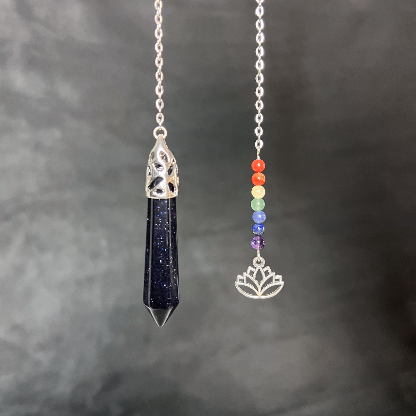 7 chakras blue sandstone pendulum with a lotus charm Baguette Magick