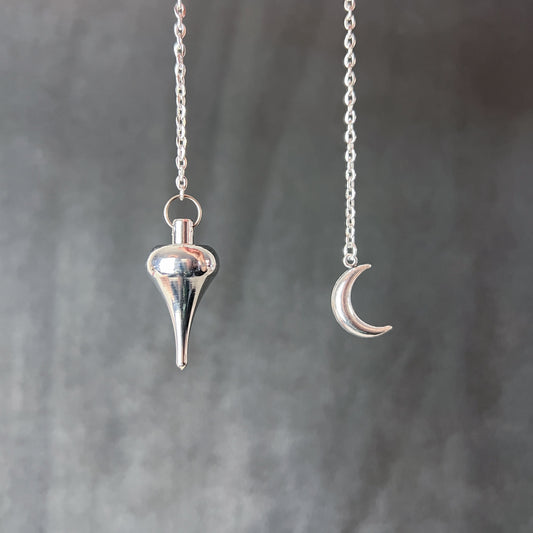 Luzi dowsing metal pendulum with a crescent Moon Baguette Magick