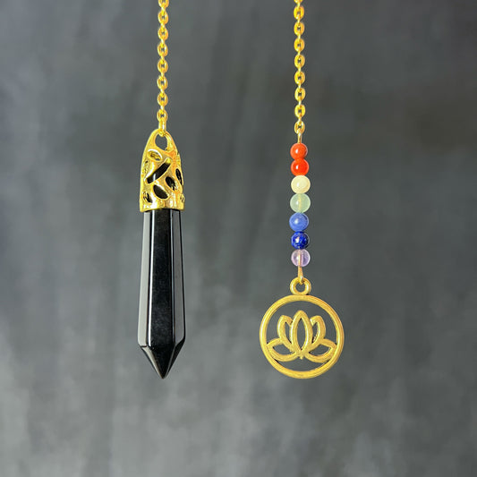 Golden onyx and seven chakras stones pendulum with a lotus charm Baguette Magick