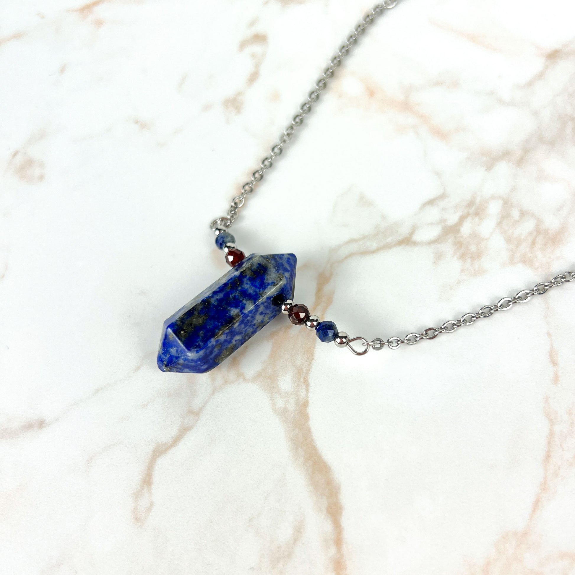 Lapis lazuli, garnet and stainless steel necklace with faceted beads Baguette Magick