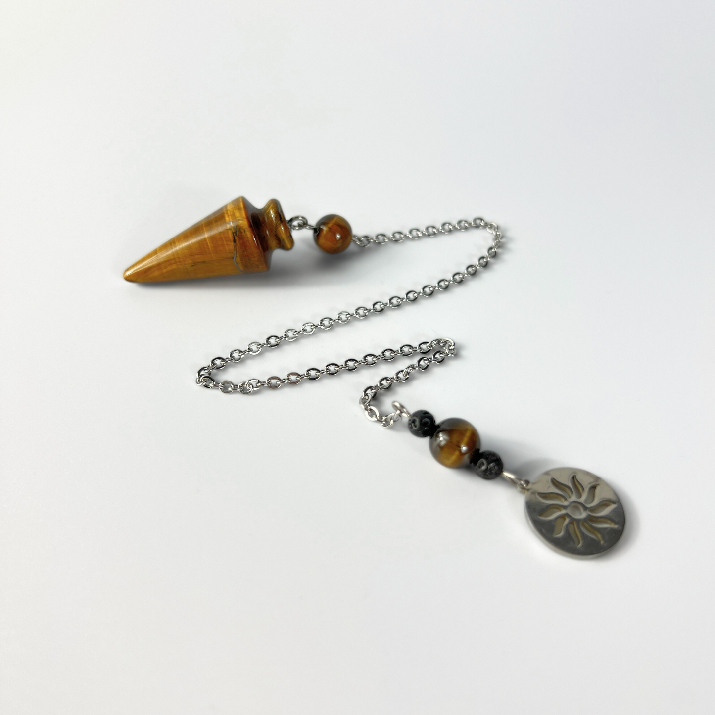 Tiger eye pendulum with a Sun charm