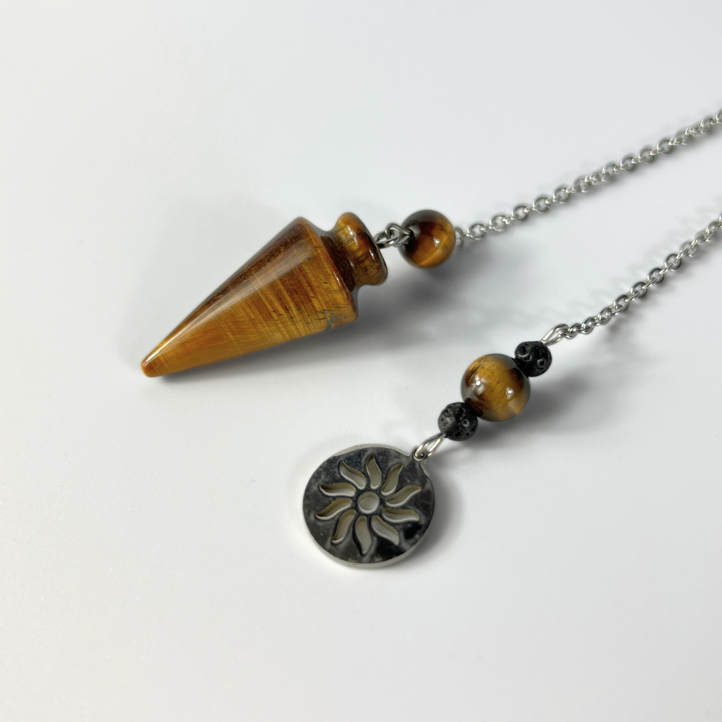 Tiger eye pendulum with a Sun charm