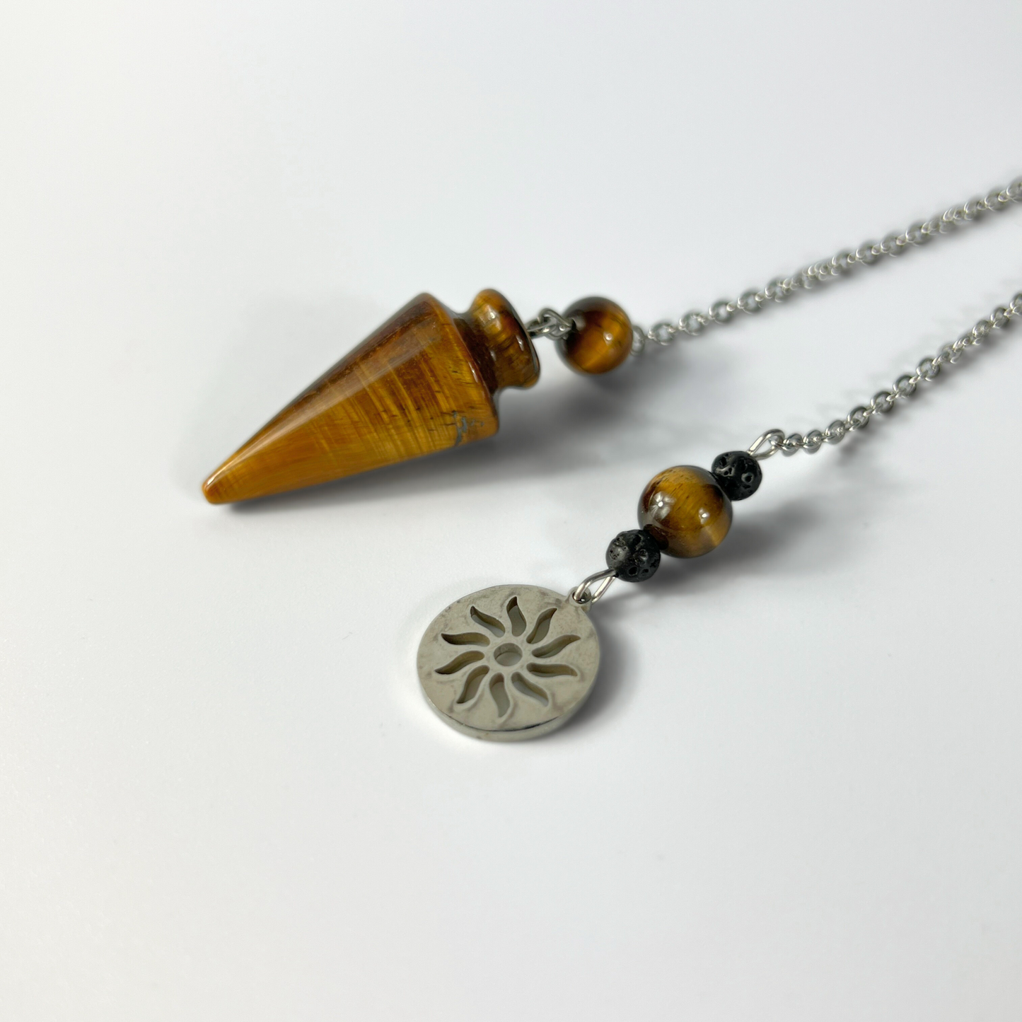 Tiger eye pendulum with a Sun charm