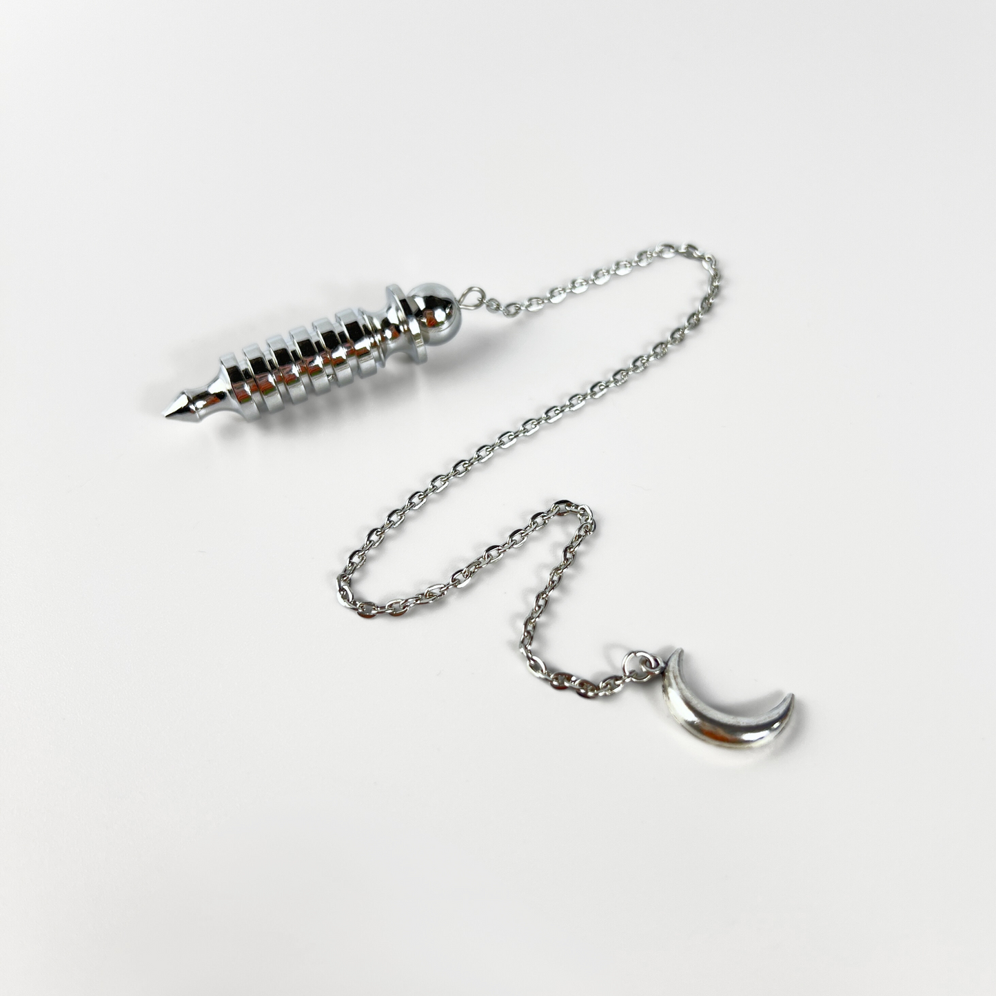 Egyptian Isis metal dowsing pendulum with a chamber and a Moon crescent