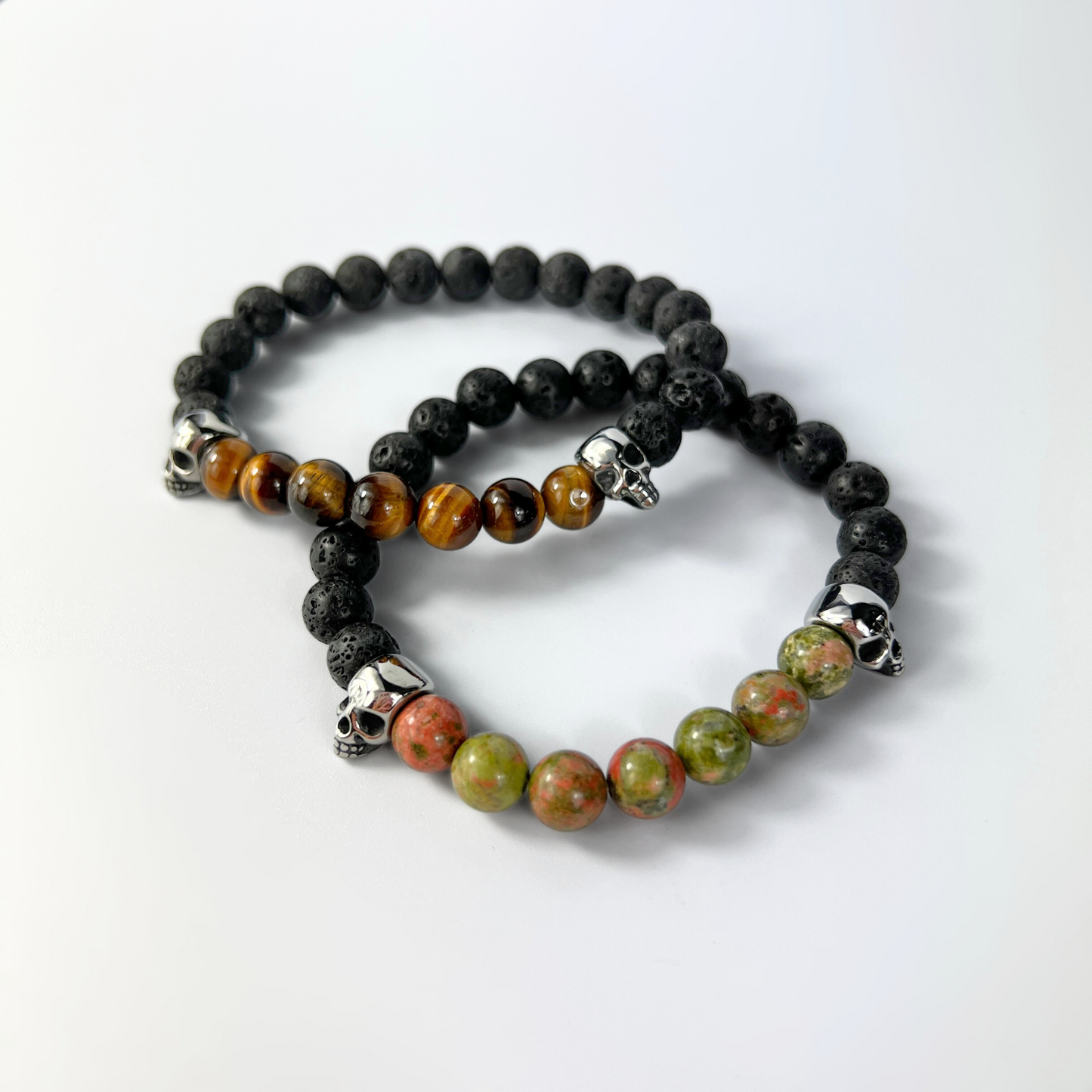 Lava rock and unakite or tiger's eye mala bracelet, with skulls