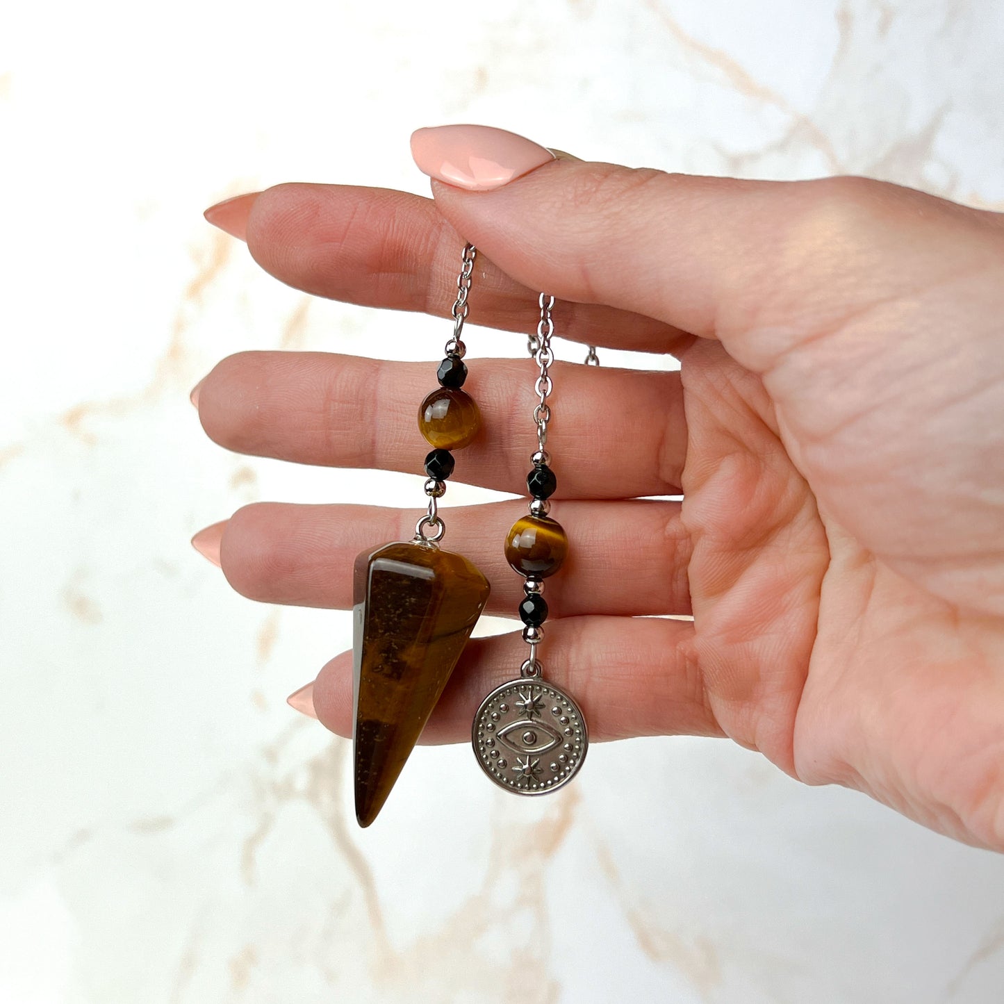 Tiger eye and onyx dowsing stainless steel pendulum with a third eye charm Baguette Magick