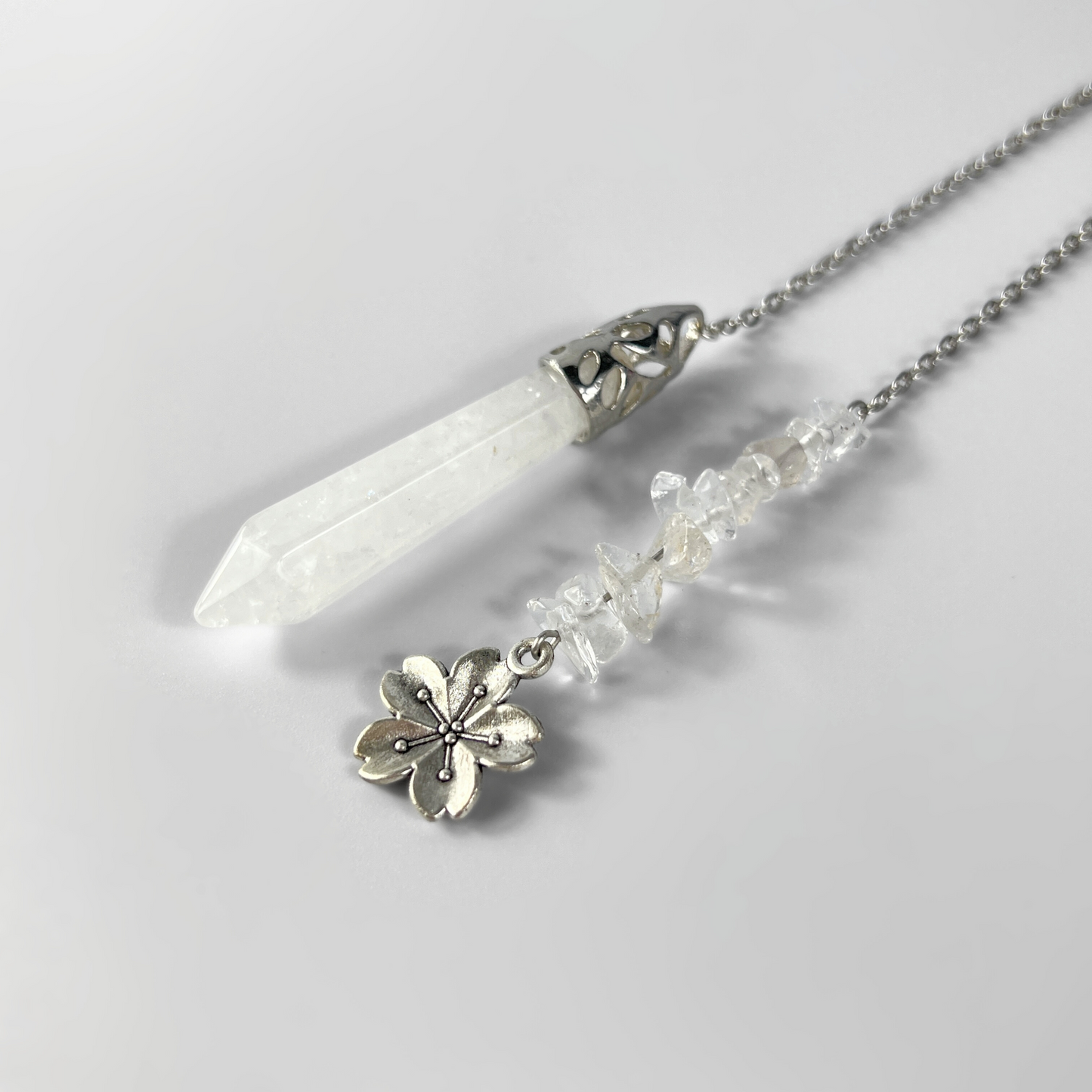 Clear quartz and flower divination pendulum