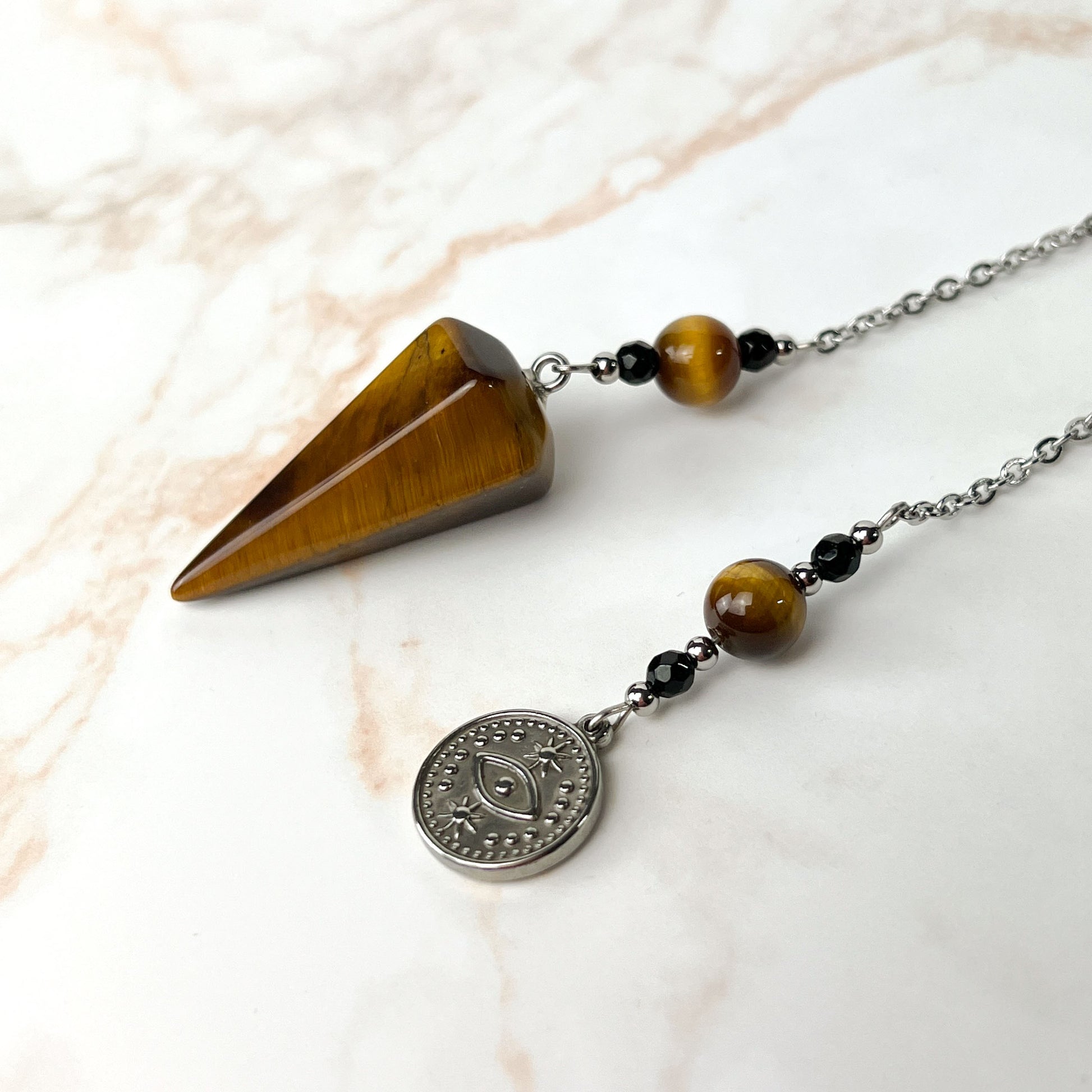 Tiger eye and onyx dowsing stainless steel pendulum with a third eye charm Baguette Magick